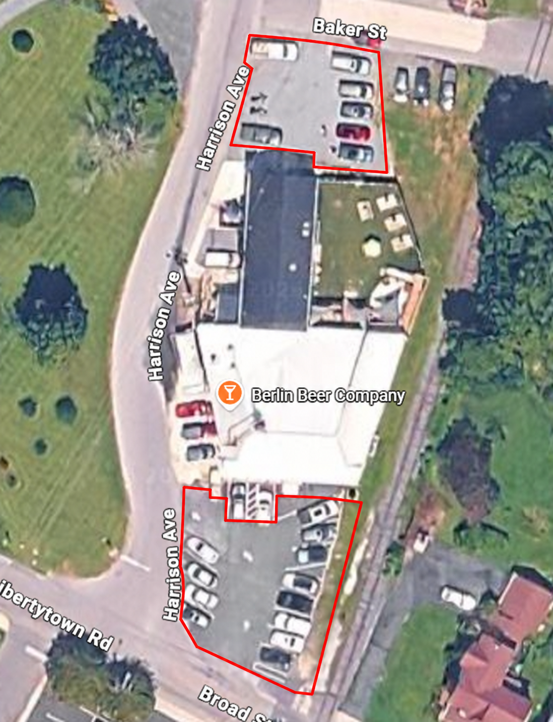 Aerial view of Berlin Beer Company with front parking off Broad Street and rear parking off Harrison Avenue and Baker Street outlined in red.