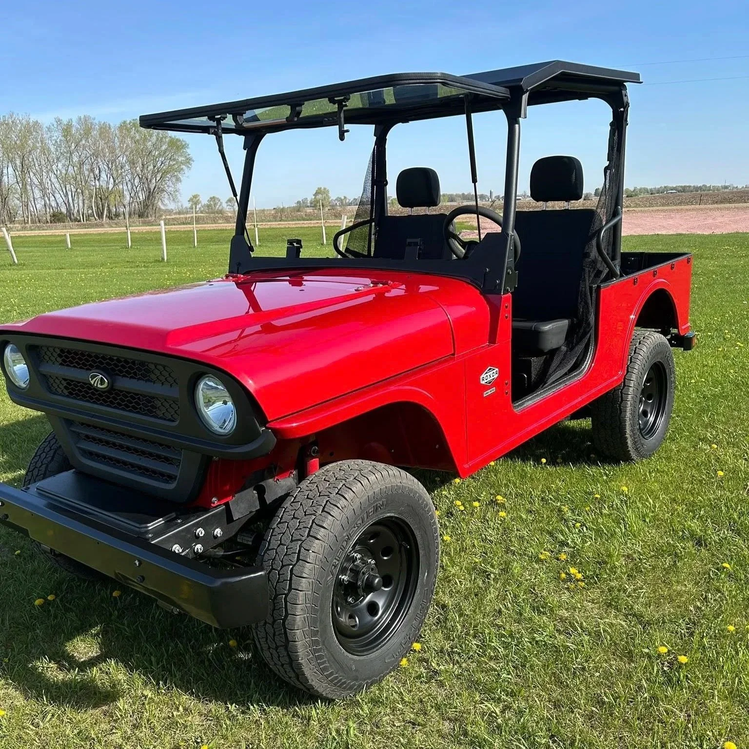 2025 Mahindra Roxor HD Base Model; Price: $22,244; $2,000 CASH DISCOUNT!; Color: Rage Red; steel body, boxed steel frame, heavy-duty transmission, 90A alternator, 16 gal/60.5 liter fuel capacity, 2 year limited warranty, 55 horsepower, side view
