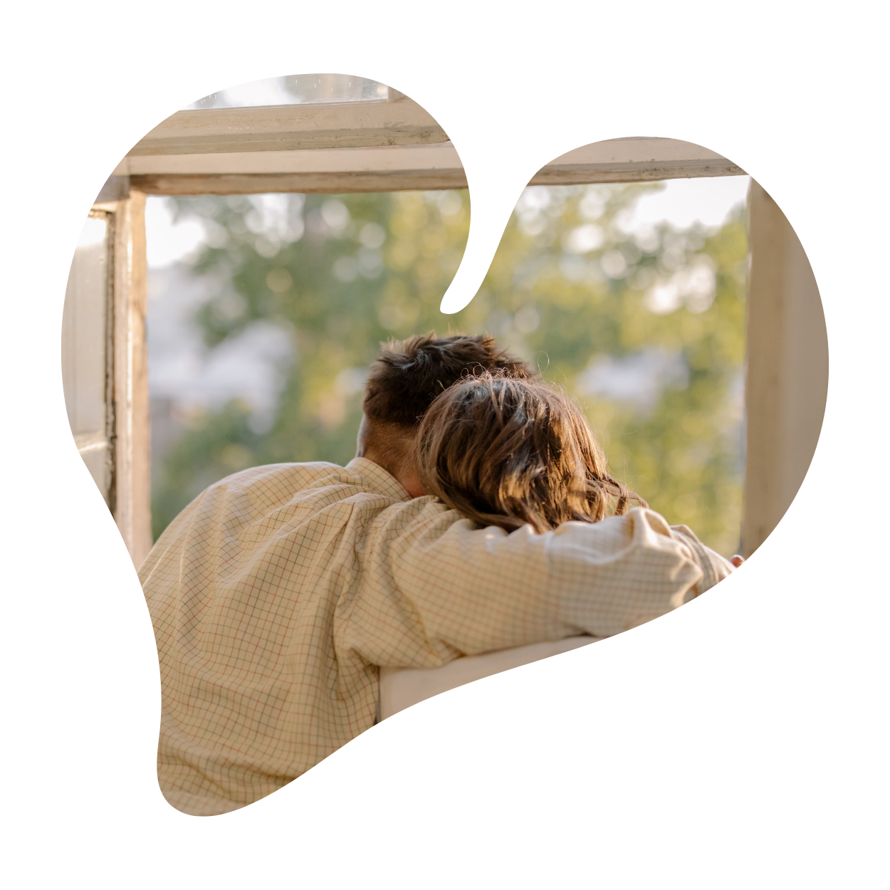 Couple in heart frame looking out window