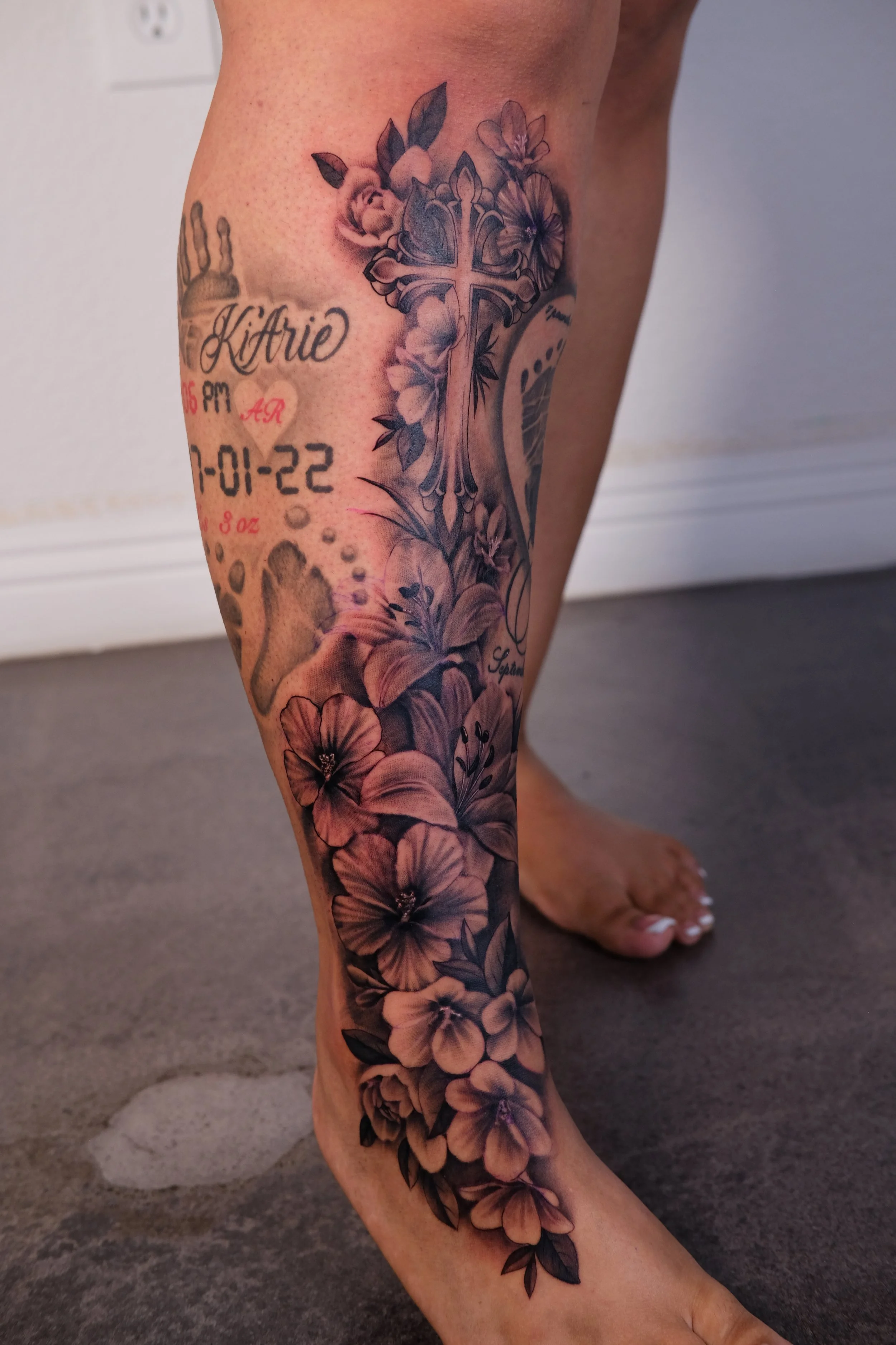 flowers and cross tattoo