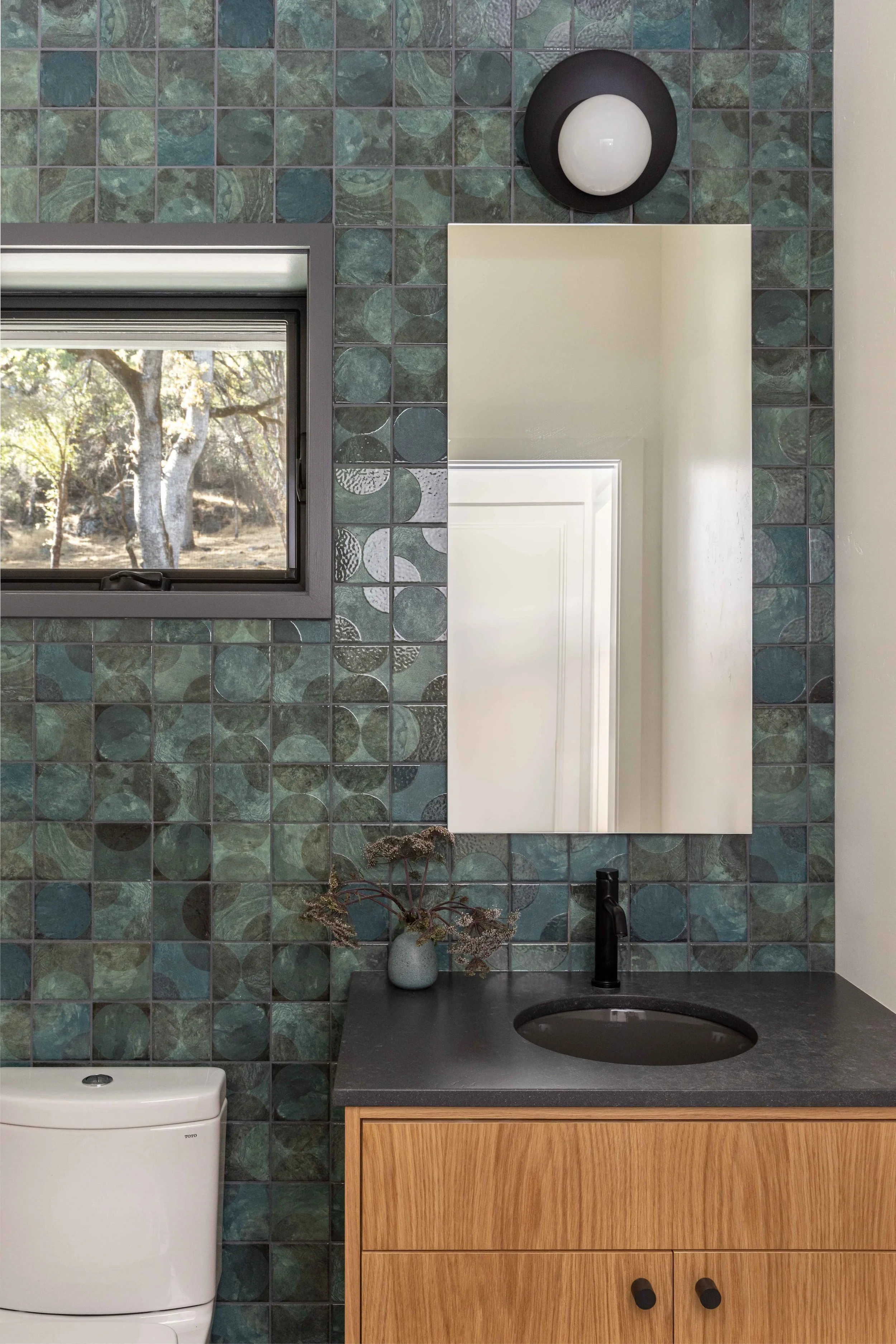 Powder room with green tile