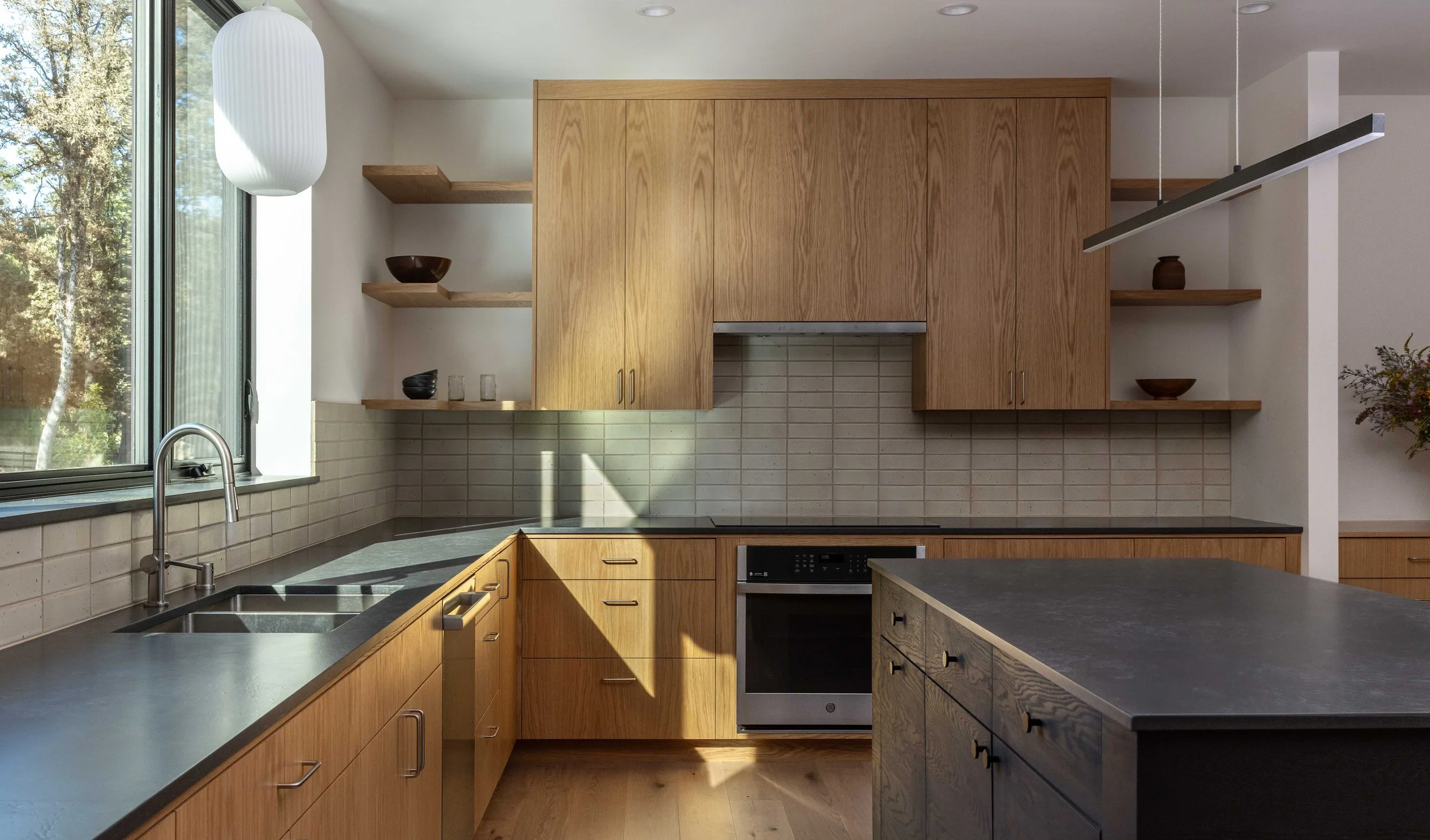 Modern kitchen with simple oak cabinets and open shelves