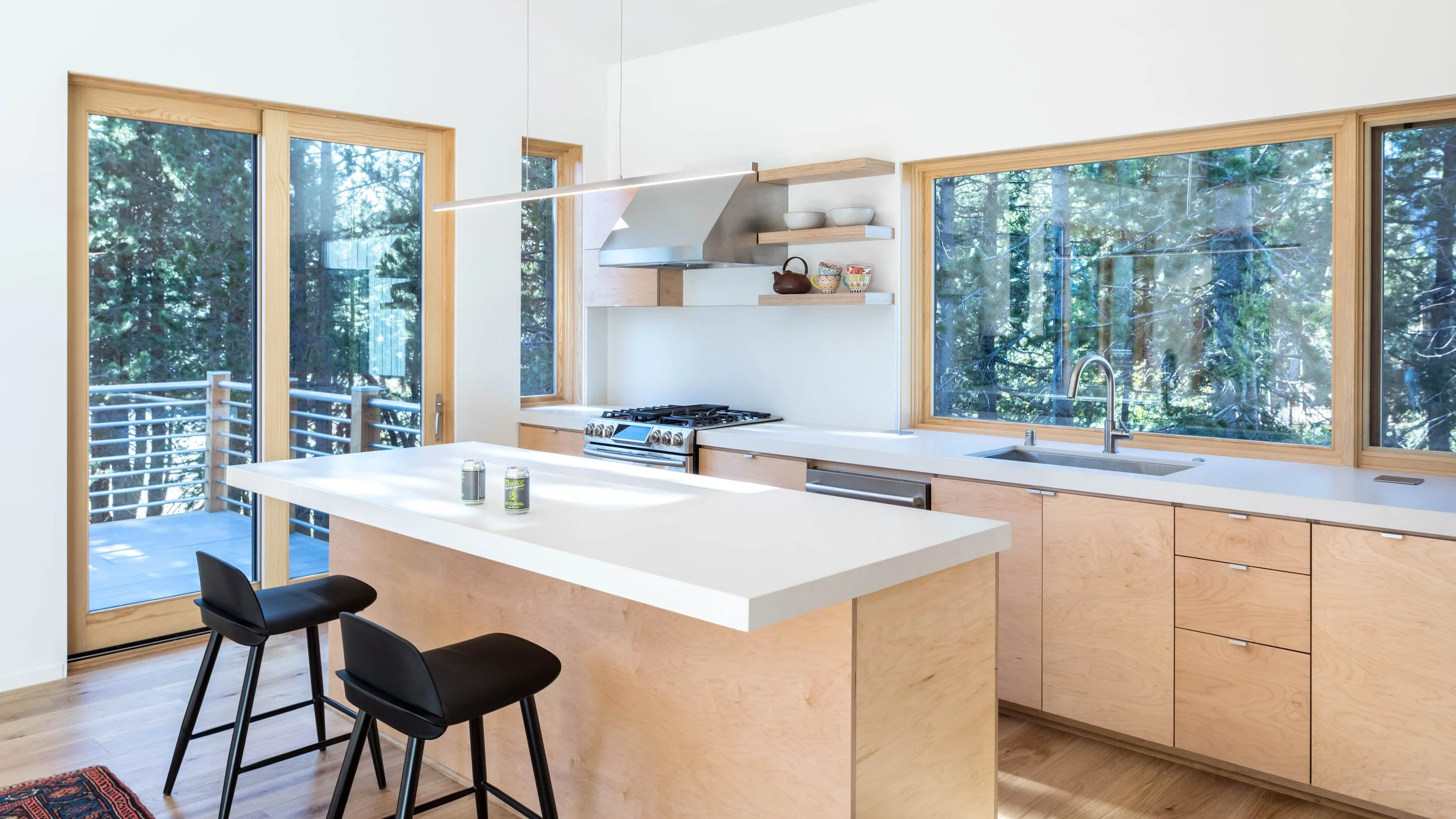 The simple light filled kitchen in the Serene Lakes cabin