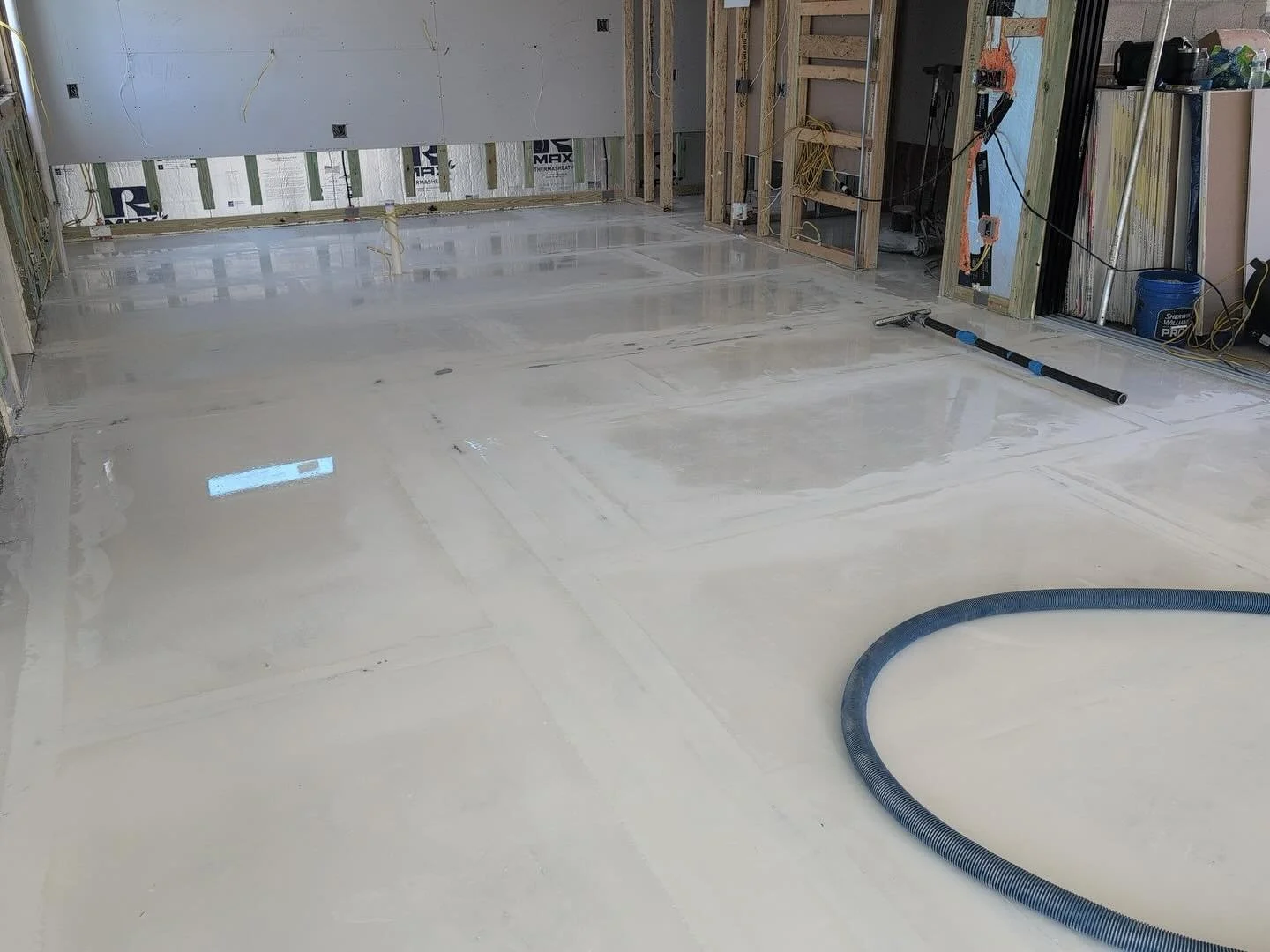 Prep and install of a terrazzo flake flooring system over wood deck in new construction home.  Fiberglassed all the seams, flood coated it with white industrial epoxy. Sanded entire floor flat and laid terrazzo flake system. Seal coat will be applied