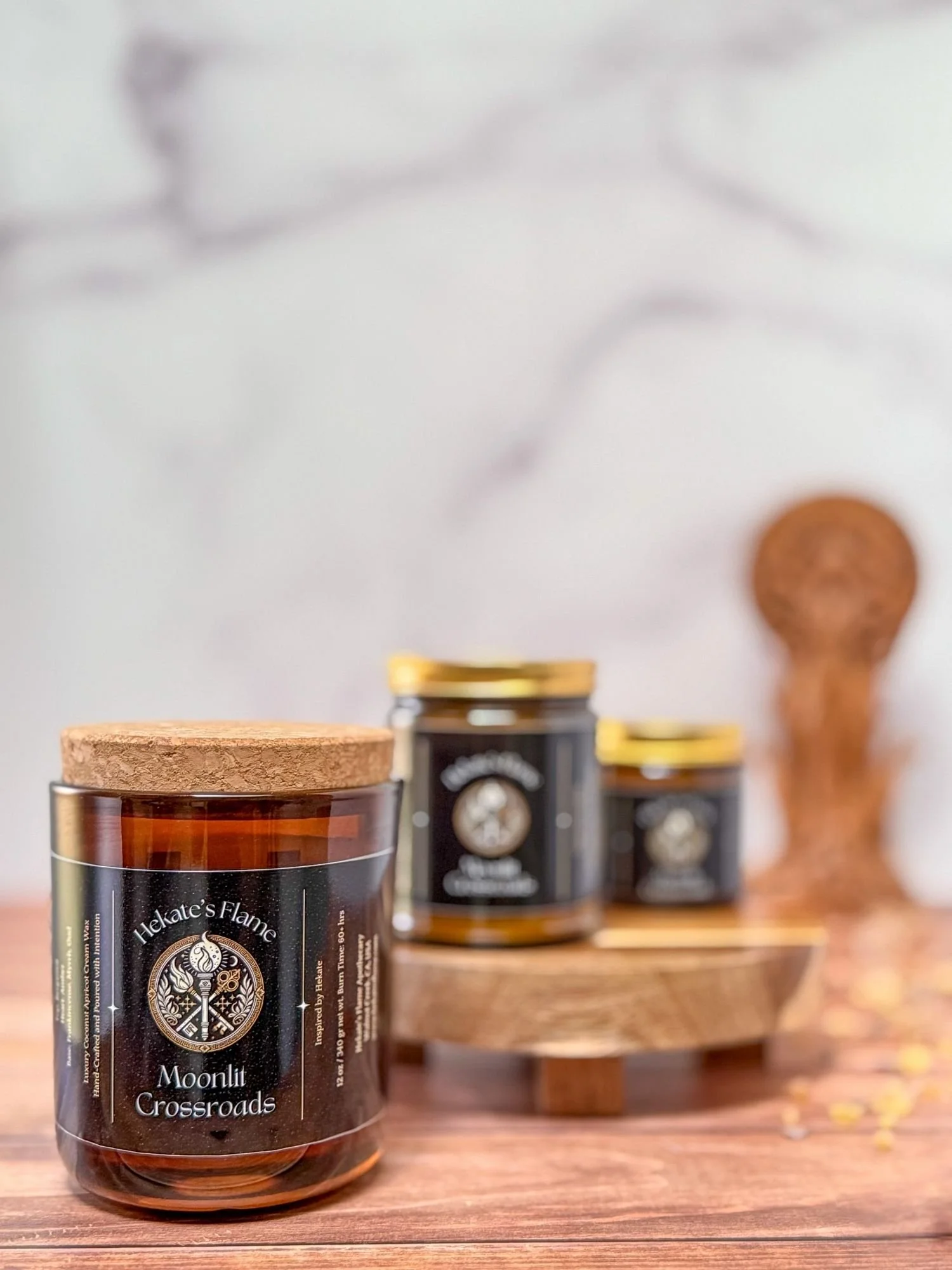 Moonlit Crossroads mythology candle set, handcrafted amber jars with cork and gold lids, luxury coconut apricot wax.