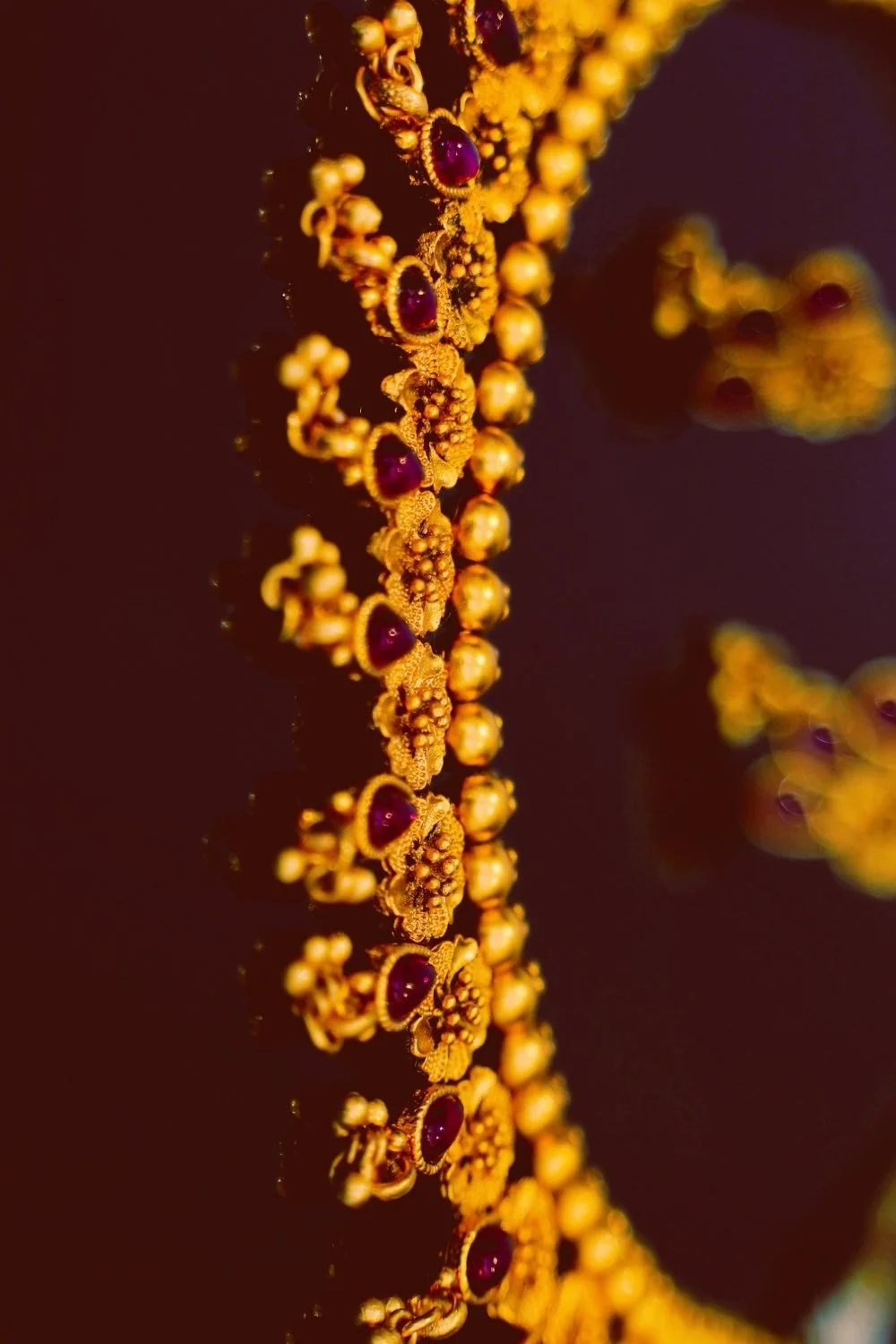 Close-up of ornate golden adornments reflecting Freyja’s love of beauty and treasure, crafted for a handmade scented mythology candle with a clean-burning wooden wick.