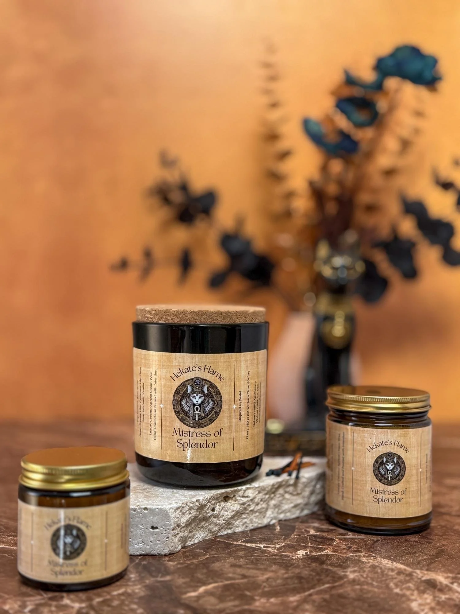Bastet candle collection in amber jars, part of the mythology-inspired candle series.