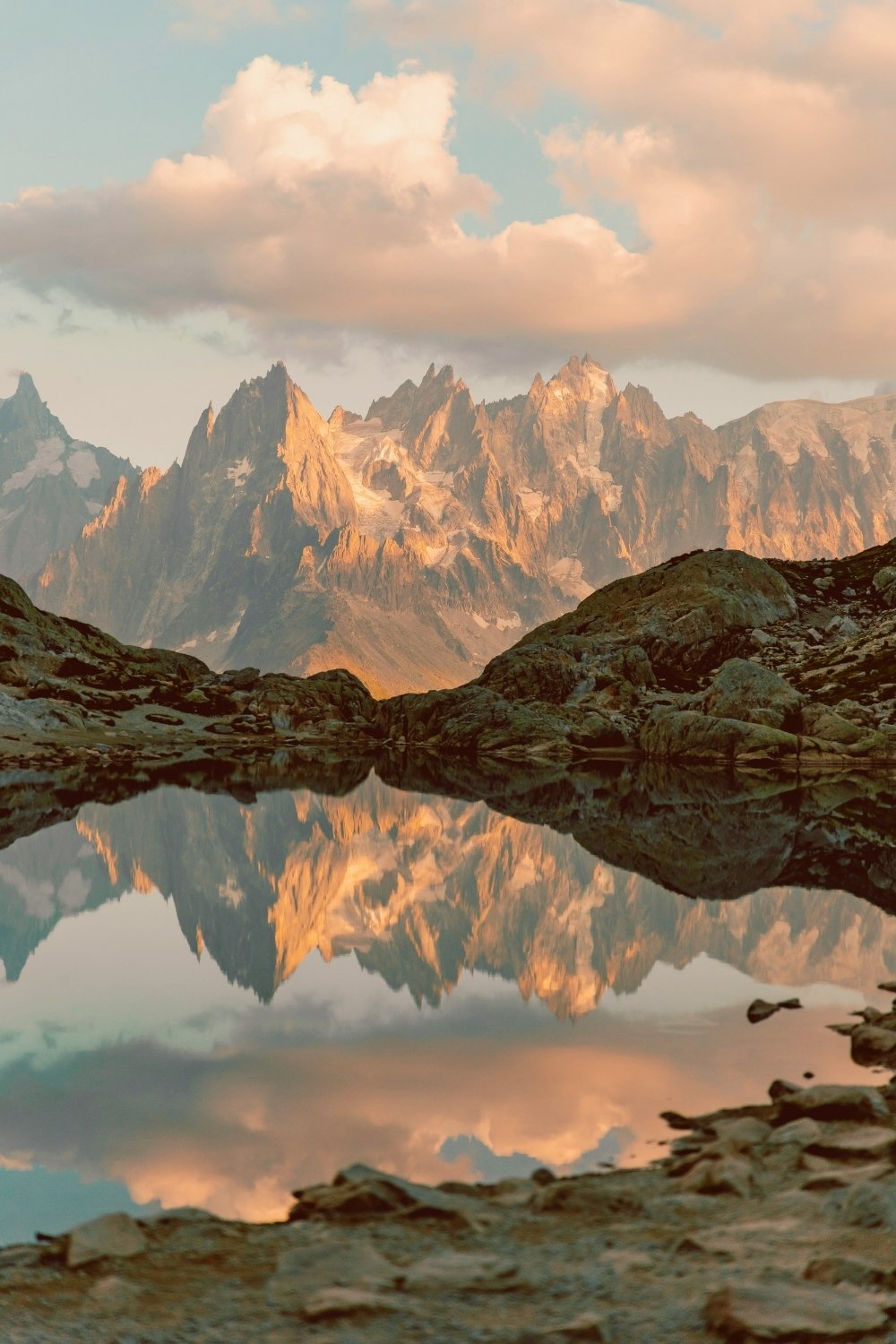 Alpine peaks reflected in still water, echoing Skadi’s frozen mountain realms for a handmade scented mythology candle with a clean-burning wooden wick.