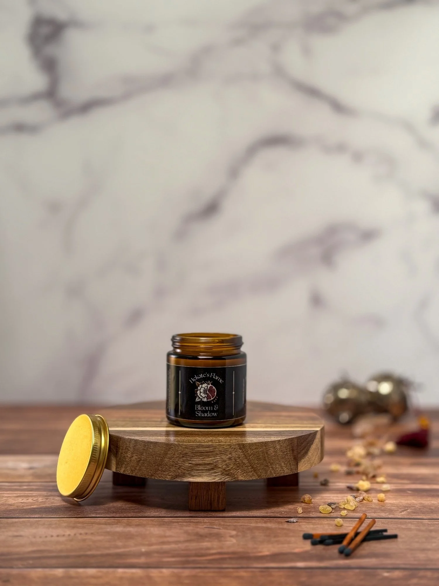 Large luxury Bloom & Shadow candle in amber glass with cork lid, handcrafted eco-conscious candle inspired by Persephone.