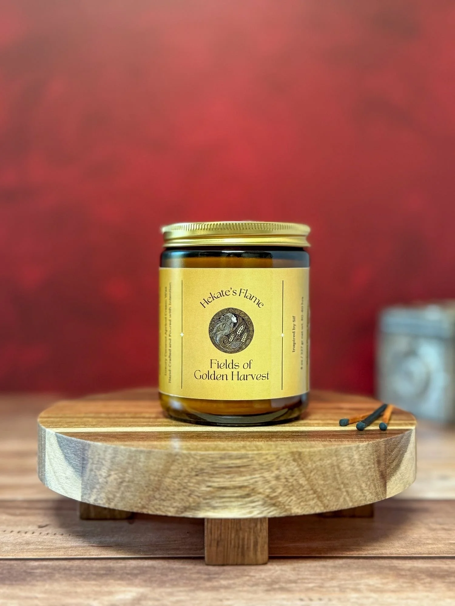 Amber glass Sif candle with gold lid – handmade luxury mythology candle, coconut apricot wax and wooden wick.