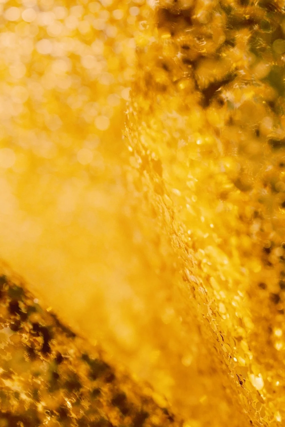 Warm amber glow echoing Freyja’s tears of gold, ideal for a handmade scented mythology candle with a clean-burning wooden wick.