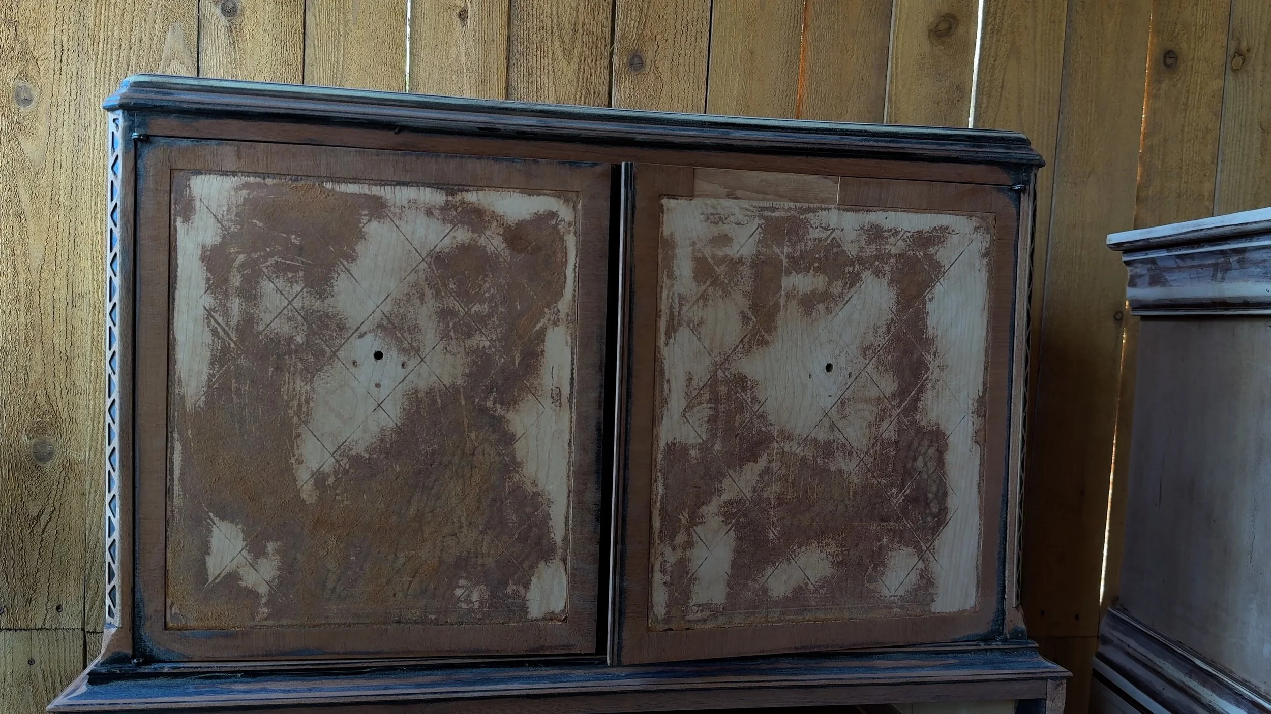 collection of vintage wooden furniture outdoors before being refinished for the guestroom