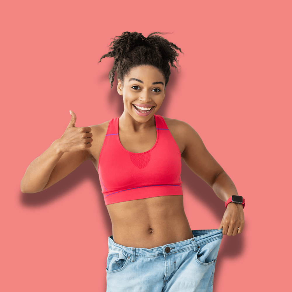 Smiling woman in a red sports bra and loose jeans gives a thumbs-up. Her expression conveys success and confidence, set against a pink background.