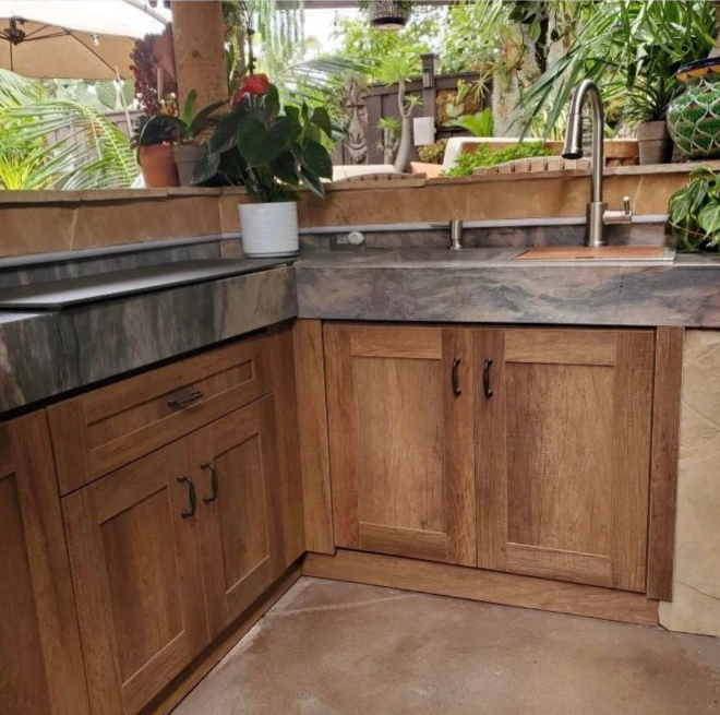 Outdoor Kitchen With A Natural Wood Aesthetic Outdoor Kitchen Remodel by Otero's Cabinets & Design project photo