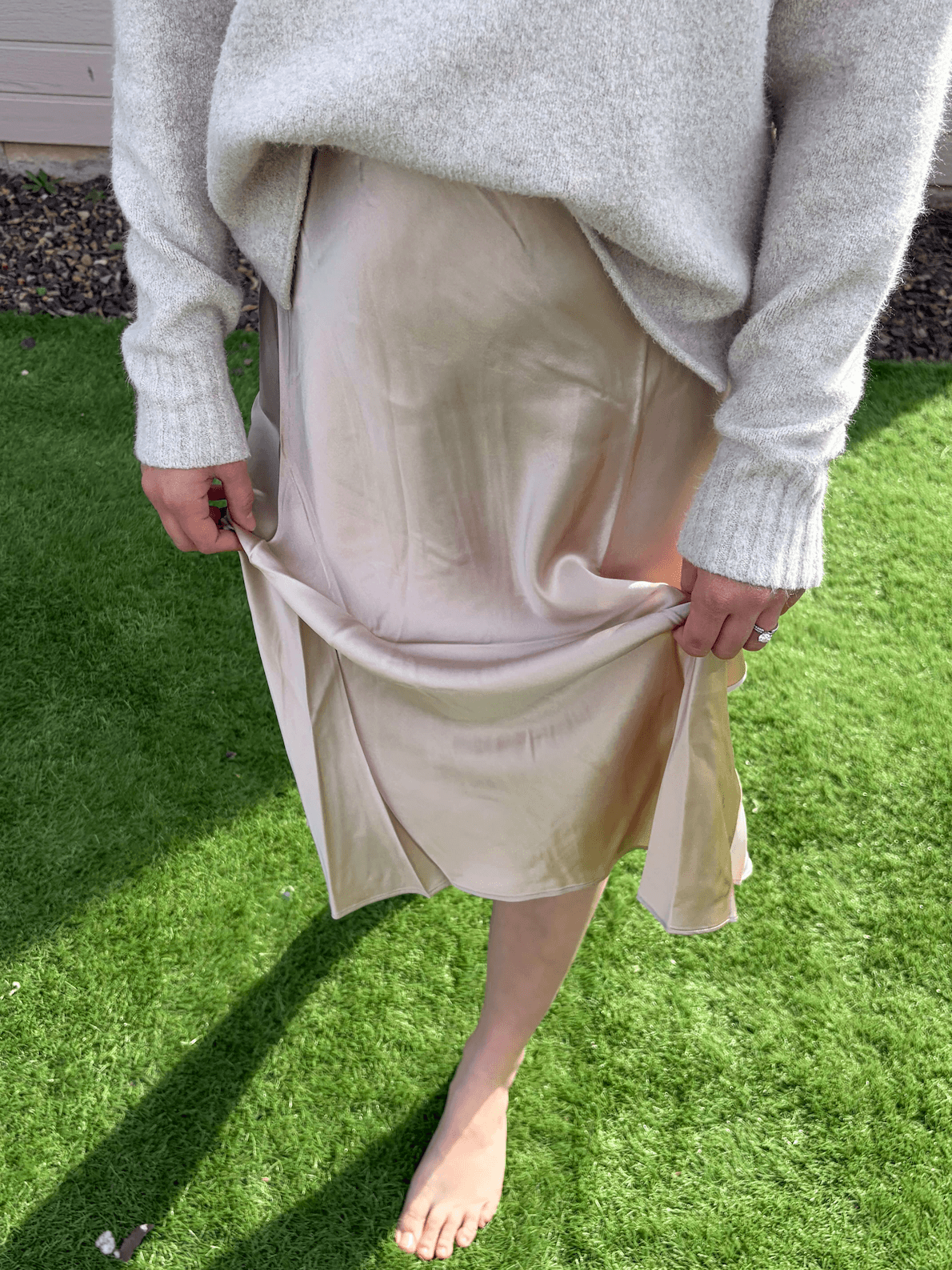 Woman wearing Quince washable silk skirt