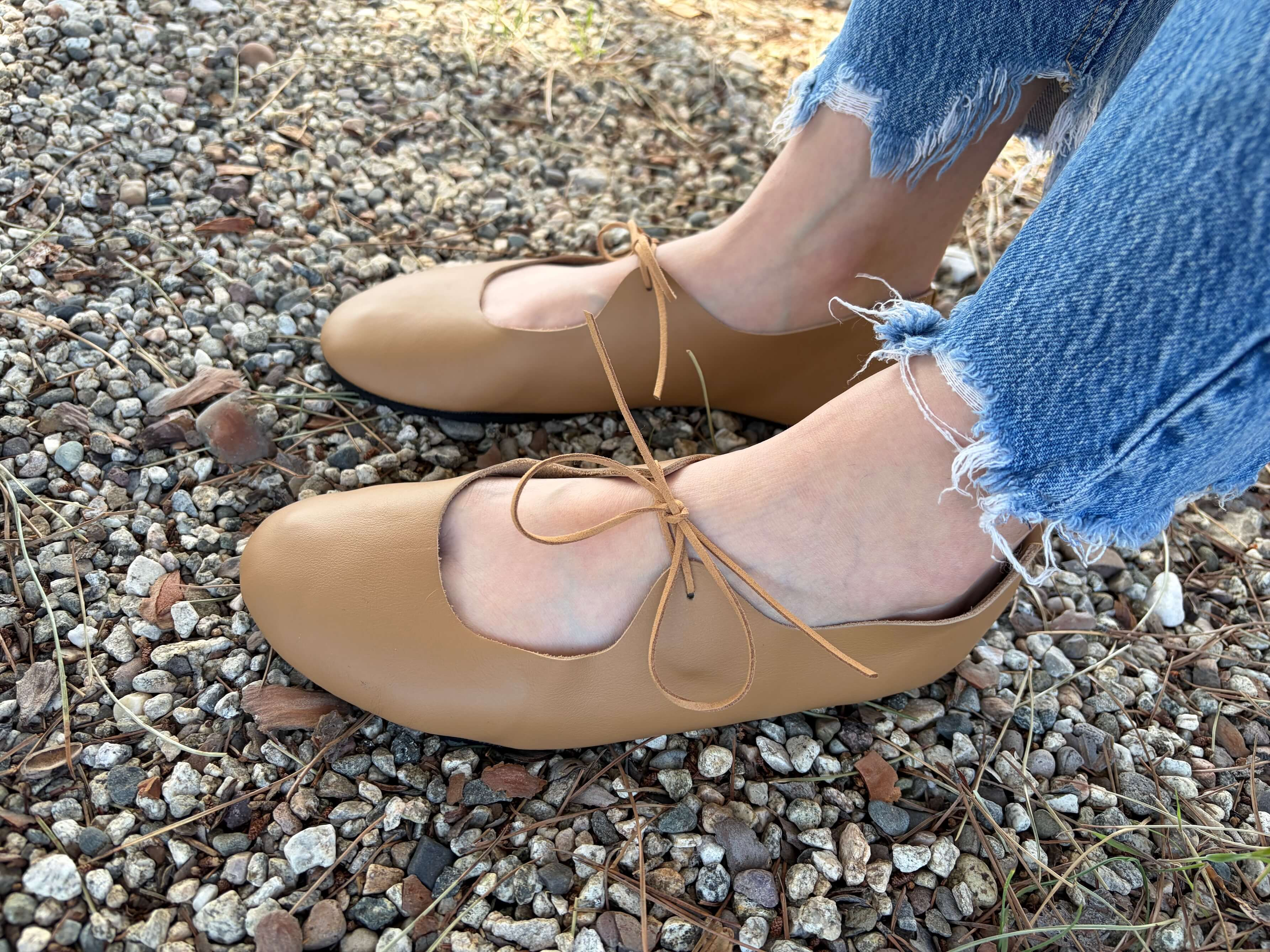 Woman wearing softstar shoes barefoot vintage tie ballerine flats