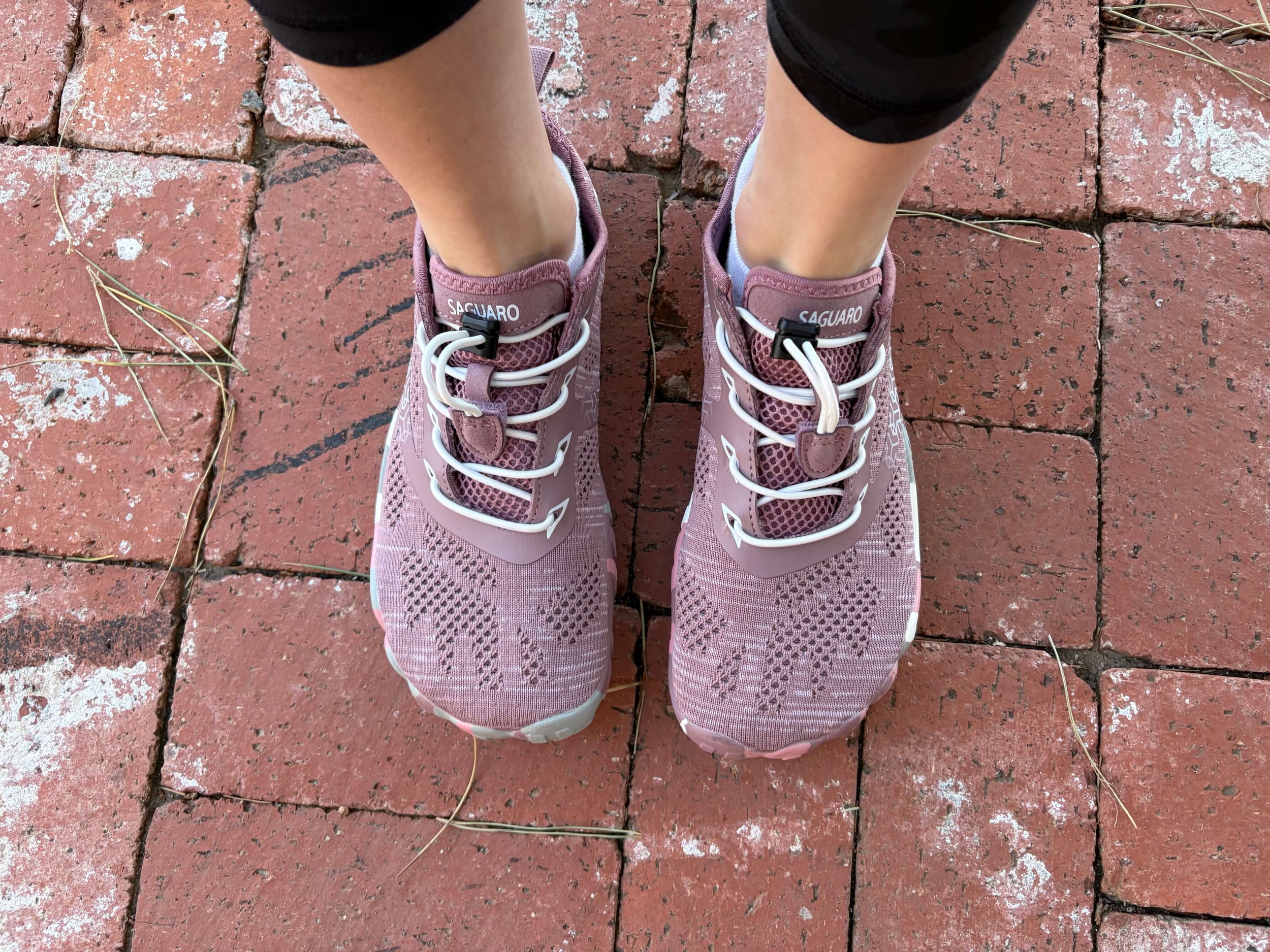 Woman wearing Saguaro Smart II Barefoot Shoes in rose red