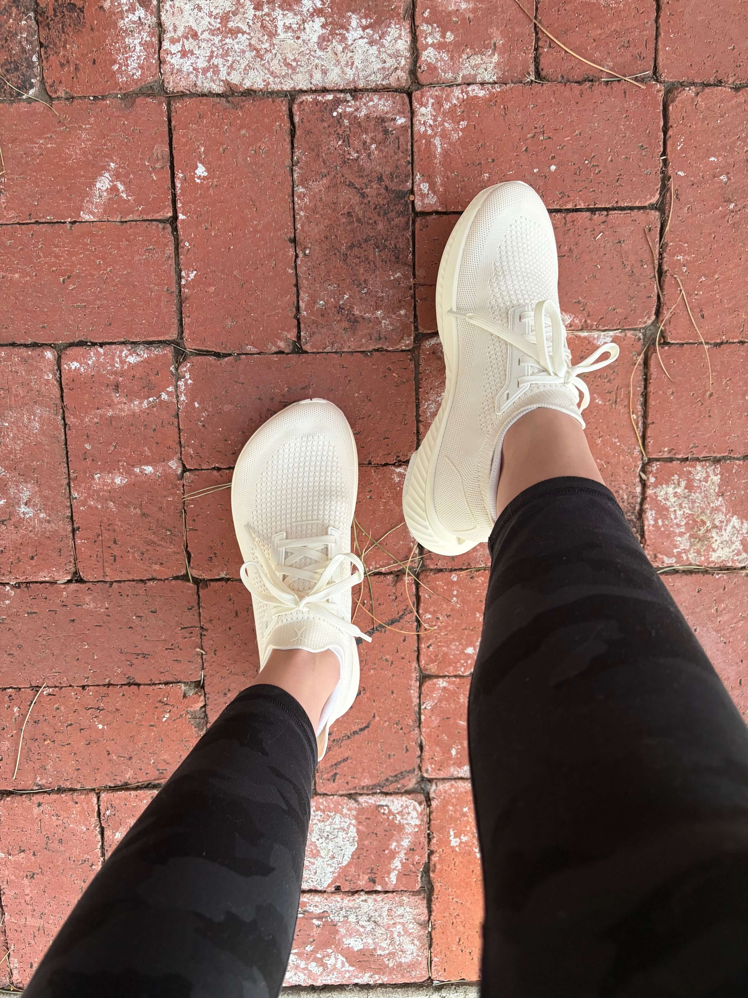 woman wearing flux footwear adapt runner in horchata