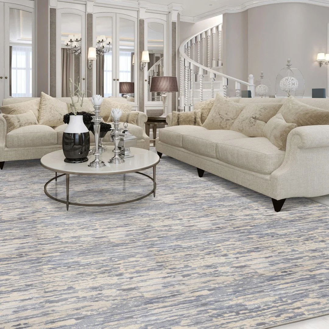 This carpet is a graceful, simple yet stunning design. Various colors come together to create this horizontal texture. Understated hints of high shine give the pattern a dressy aesthetic. High low pile adds yet another layer to this multifaceted gem!