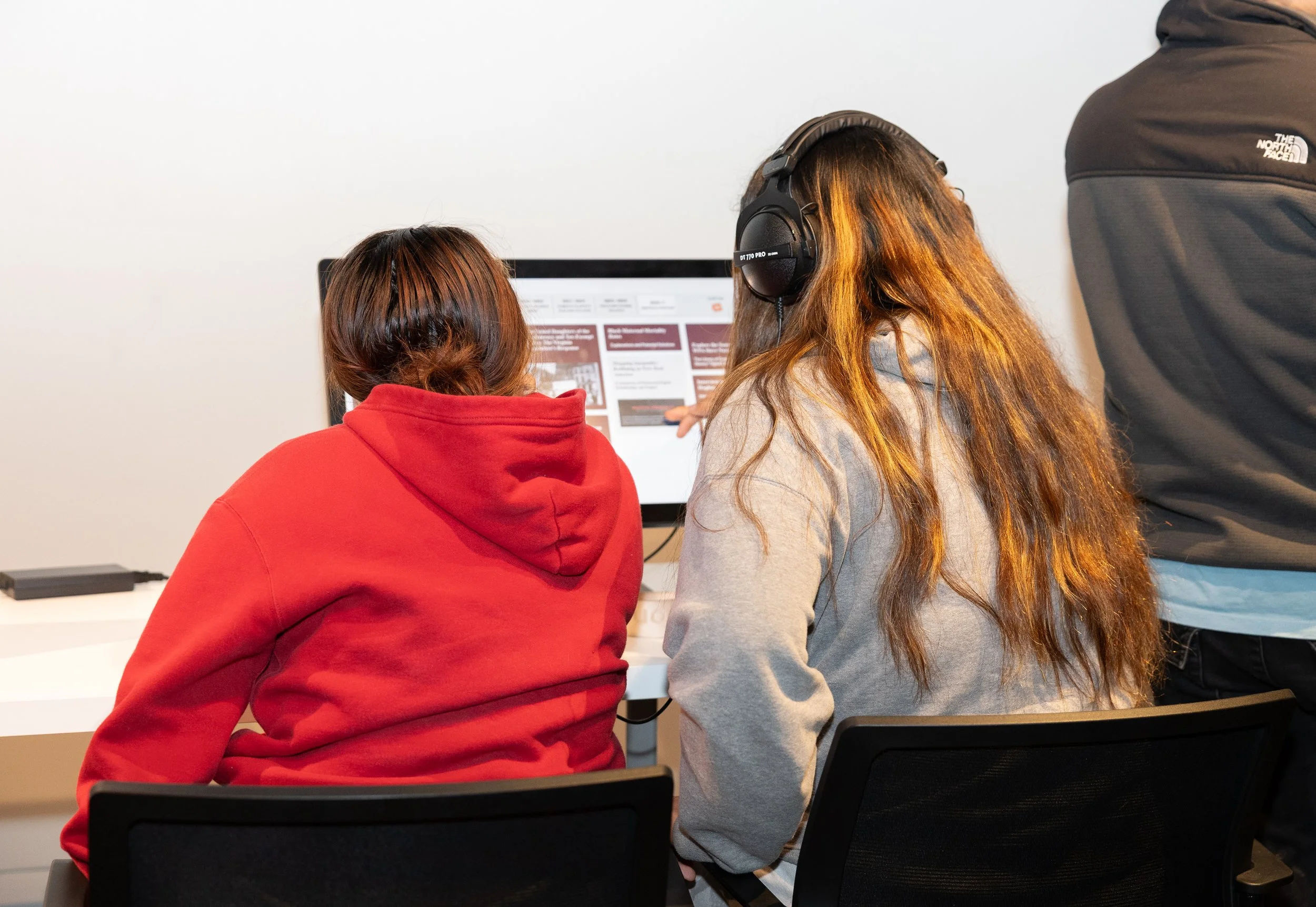Visitors deepen their learning journey by exploring resources on the Shockoe Institute's Library.