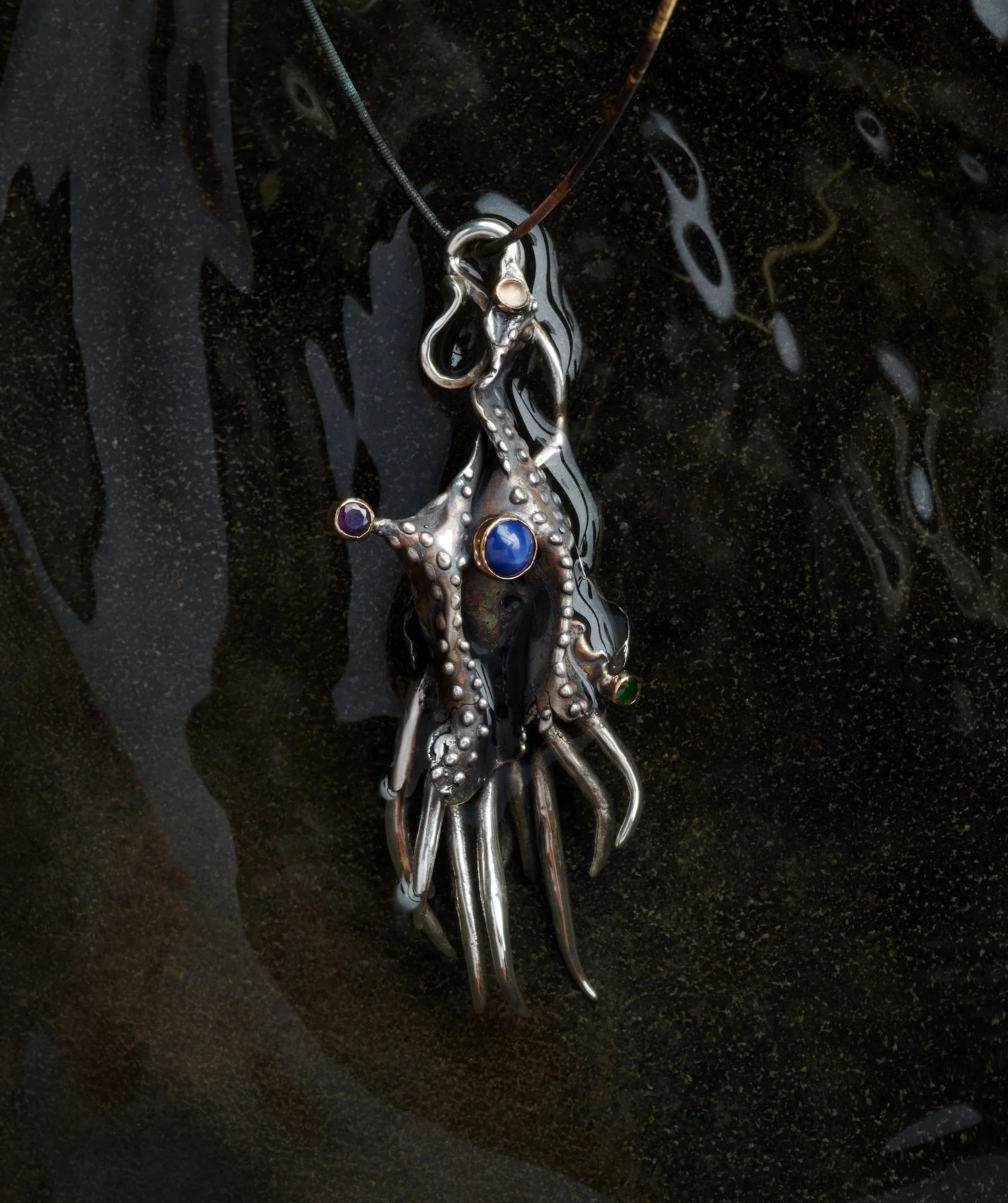 Temporal Traveller of Sky and Sea.  Sterling silver, 14k gold with Star Sapphire, Emerald Amethyst, Moonstone.  2025.  Sold.