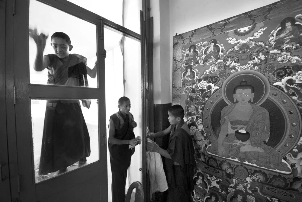 Young Monks Washing Windows