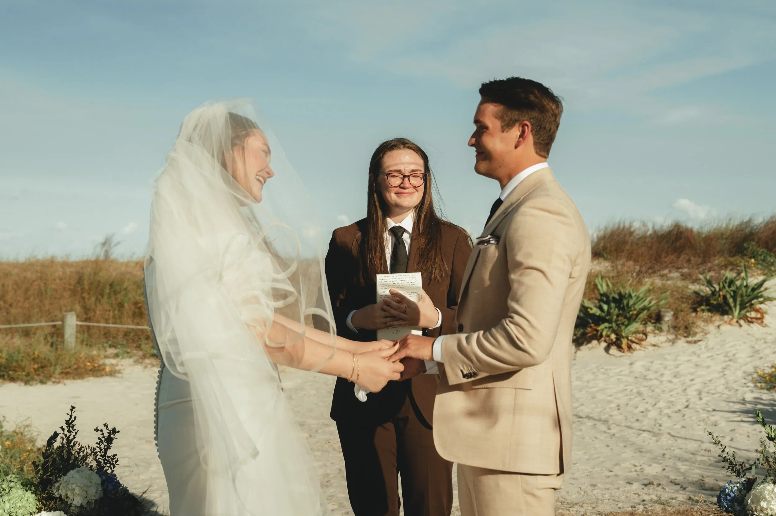 Wedding ceremony on the beach in Florida - photographer capturing an emotional moment