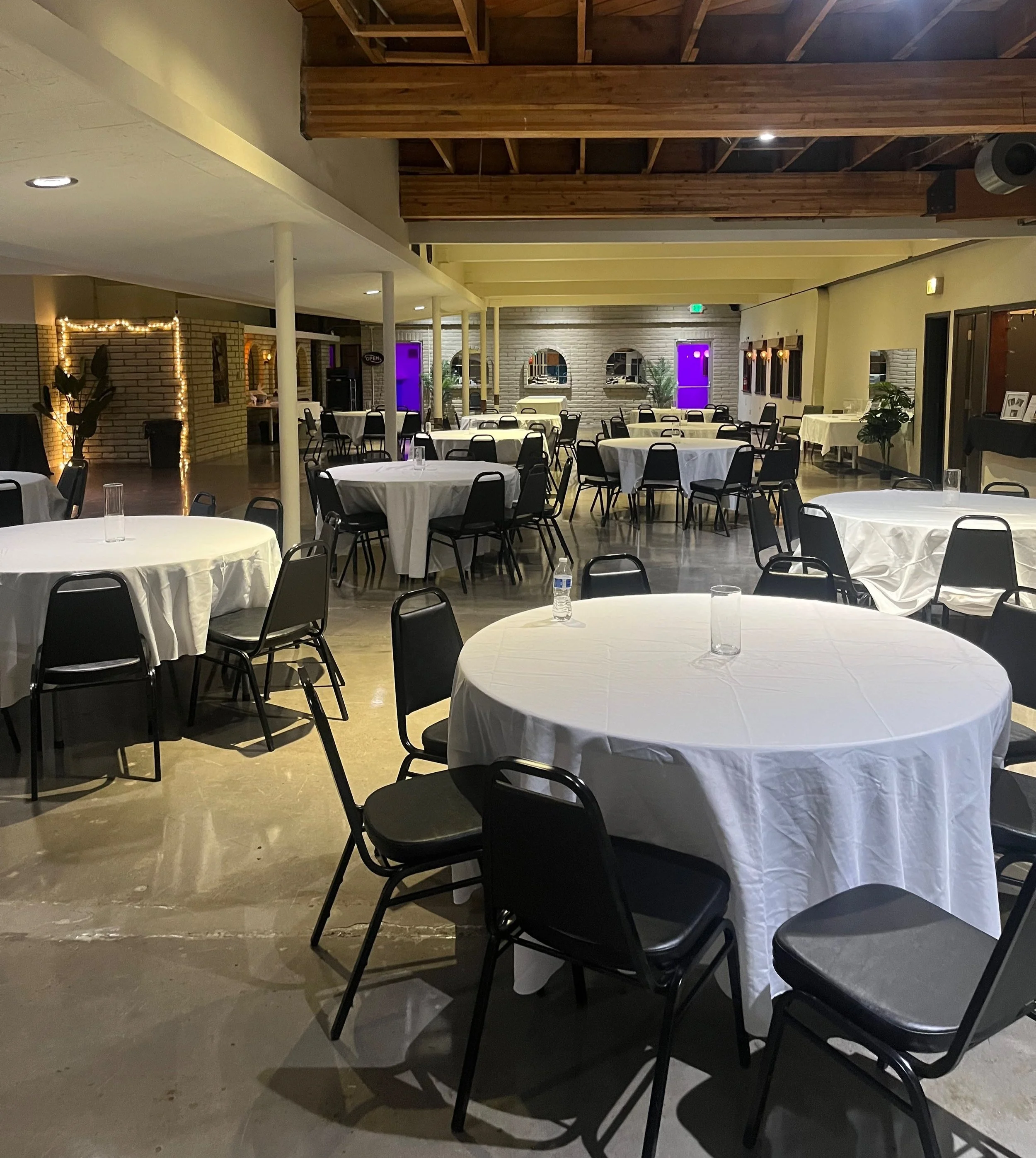 Wedding Banquet Tables and Black Chairs