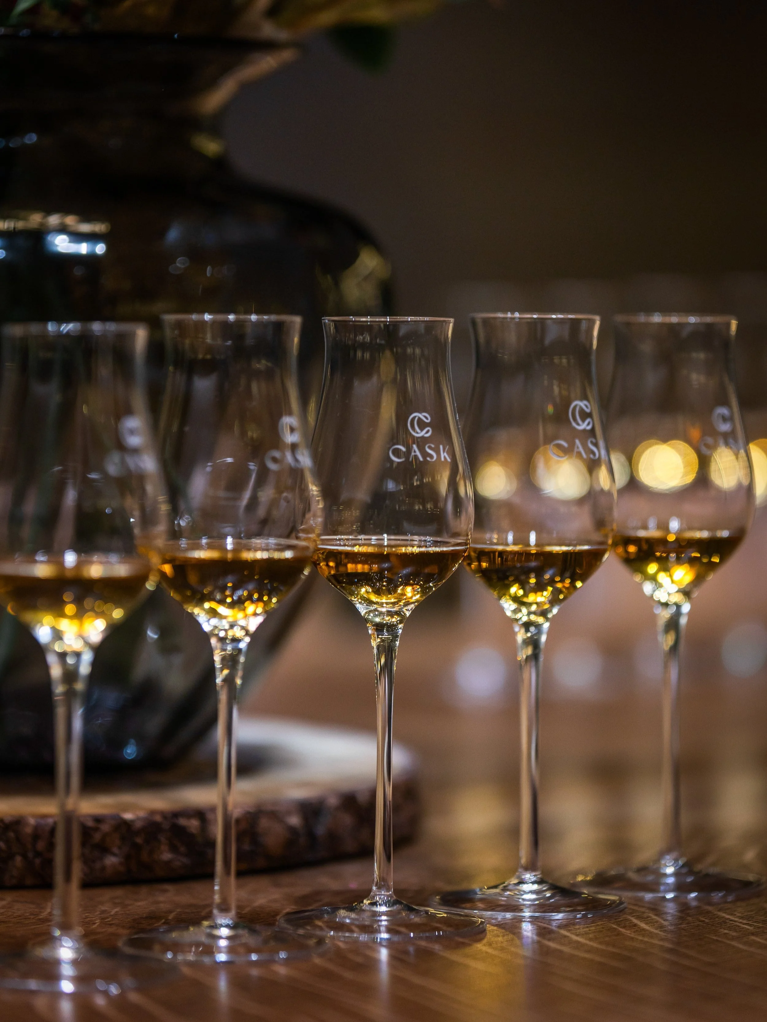 Guests enjoying a guided whisky tasting at Cask in Grand Cayman