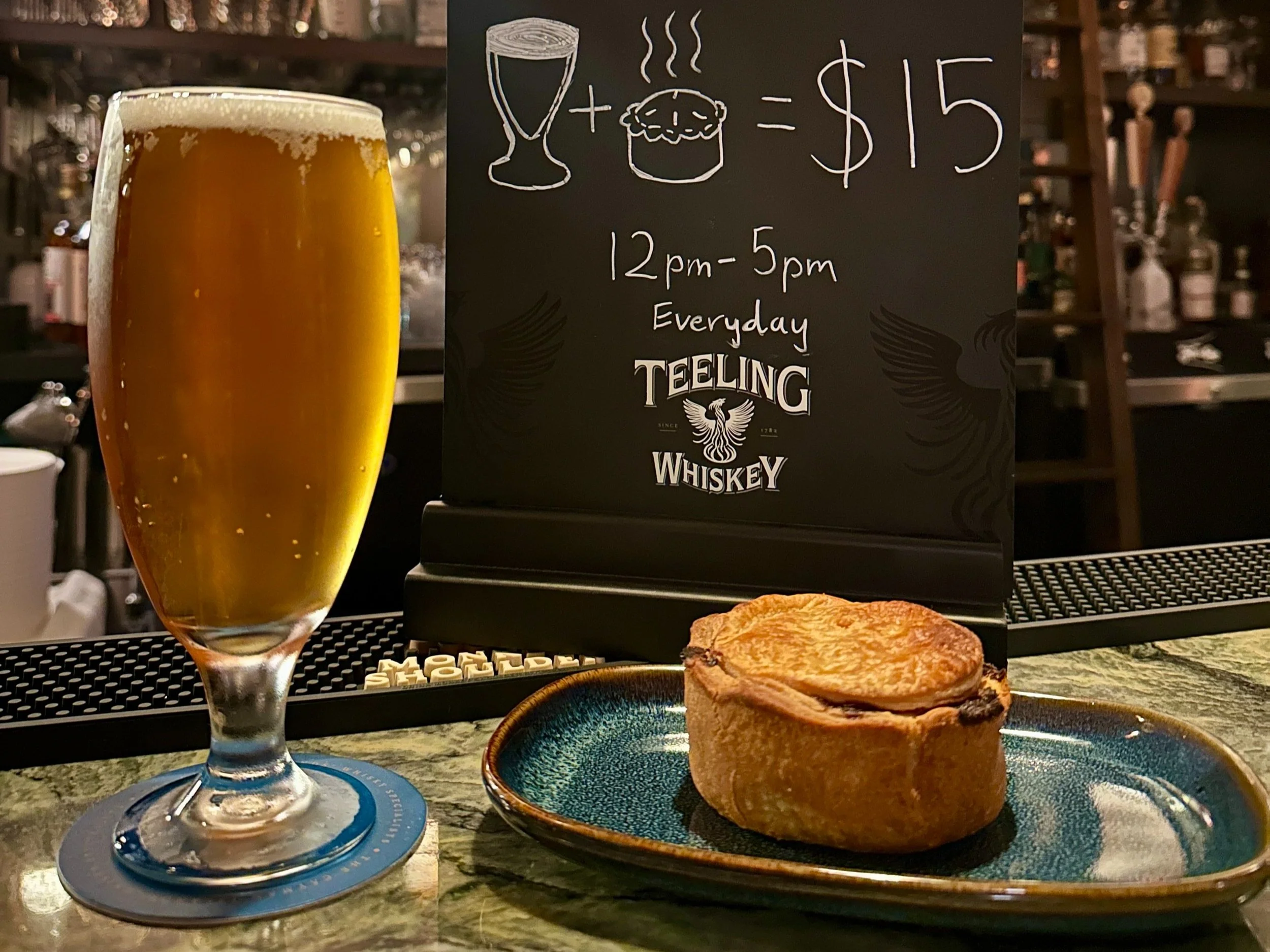 Locally made pie served with beer at Cask whisky bar in Grand Cayman