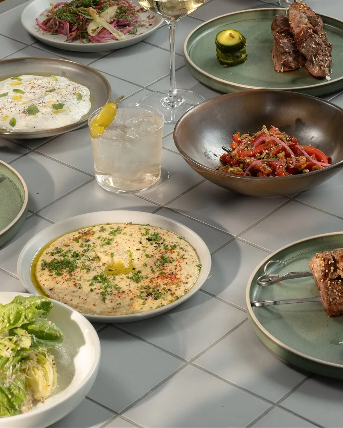 The new Rambler menu is here.
Fresh mezze plates, familiar faces, and a few new flavours to fight over.
Think grilled pita brushed with olive oil, whipped ricotta with lemon zest, cumin-marinated lamb skewers, and fries with a hit of magic salt.
Book