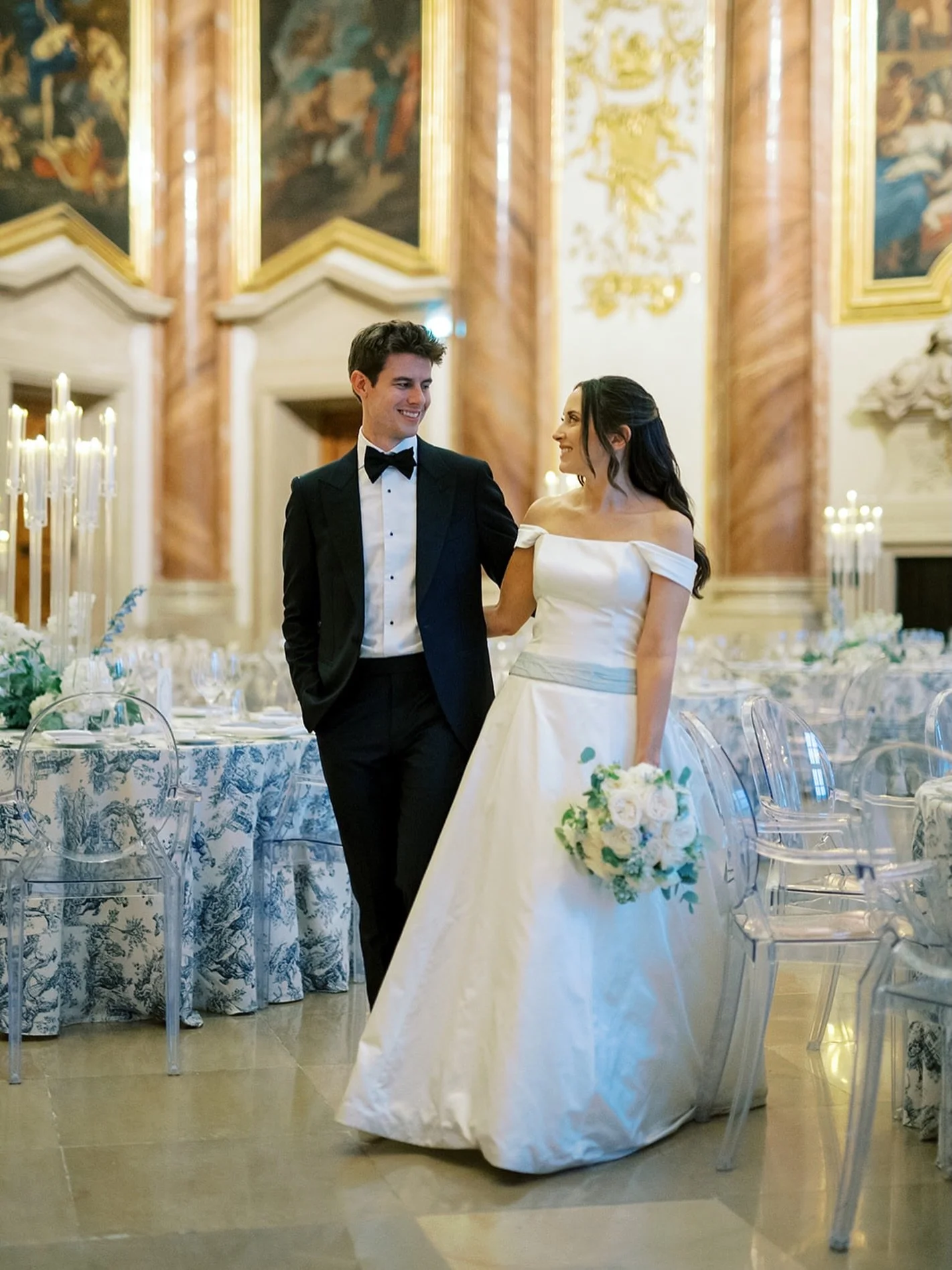 We love this moment, when the couple takes a glimpse onto the tablesetting after the ceremony and during the cocktail hour 💛✨

Photo by @sotiris_tsakanikas 
Venue: @palaisliechtenstein 
Florals and d&eacute;cor: @hanaholdener 

#destinationweddi