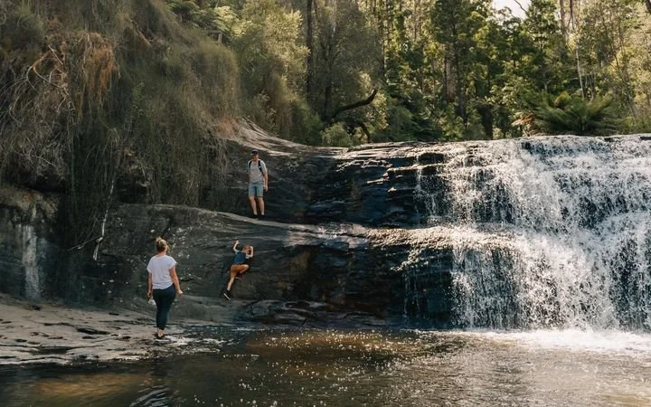 Morwell-River-Falls-family-climbing-around-waterfall-cascades_aaf6aaddc334d0db8c7aca445110487e.jpeg