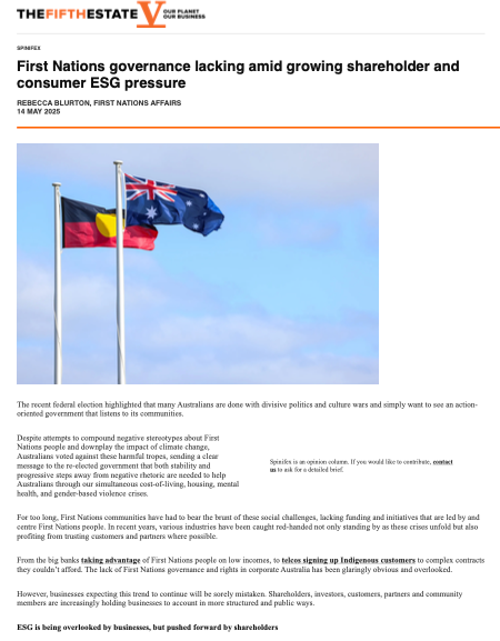 Australian and Aboriginal flags flying against a blue sky.