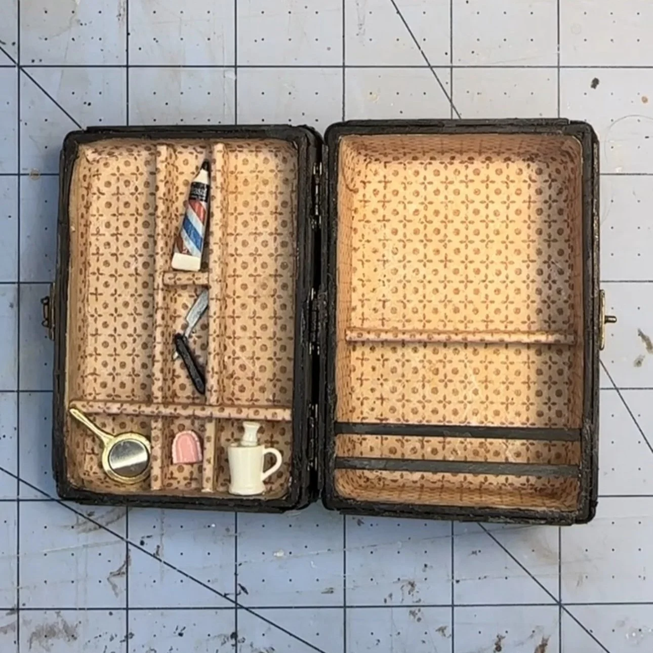 Interior, with necessary toiletries: shaving kit, mirror, false human teeth