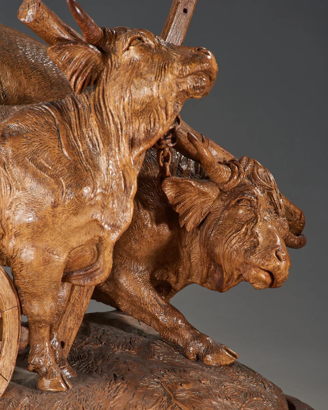 Lead ox head detail showing strain and musculature, attributed J. Huggler carved walnut group, Brienz, circa 1870