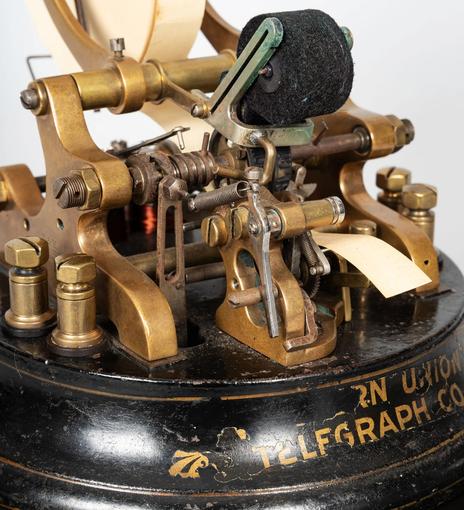Brass mechanism detail and gilded Western Union Telegraph Co base inscription