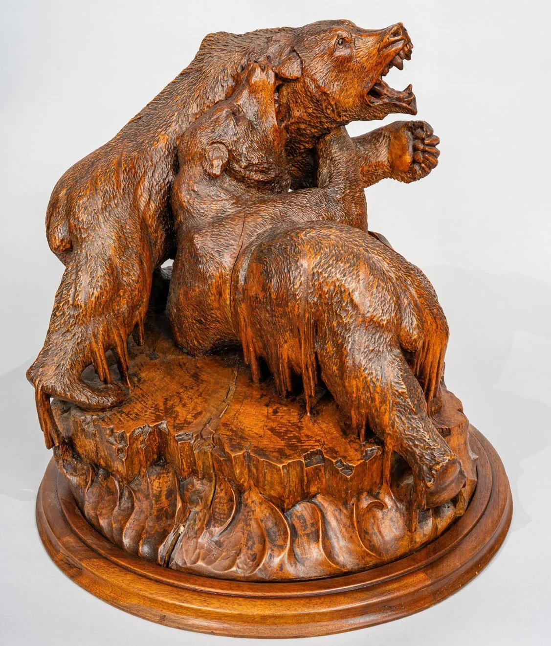 Swiss Black Forest carved walnut group of two bears fighting on ice floe, Brienz late 19th century, full view