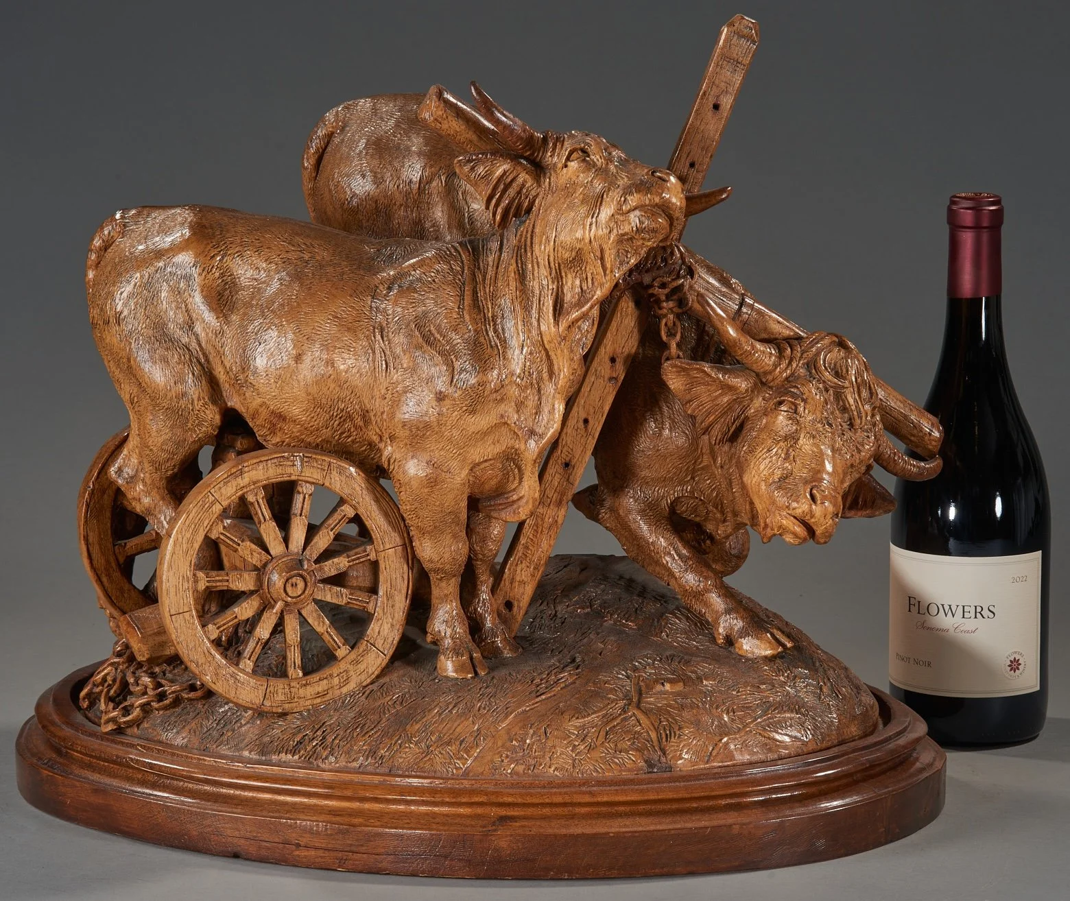 Swiss Black Forest carved walnut yoked ox group with cart, attributed to J. Huggler, Brienz, circa 1870, with scale