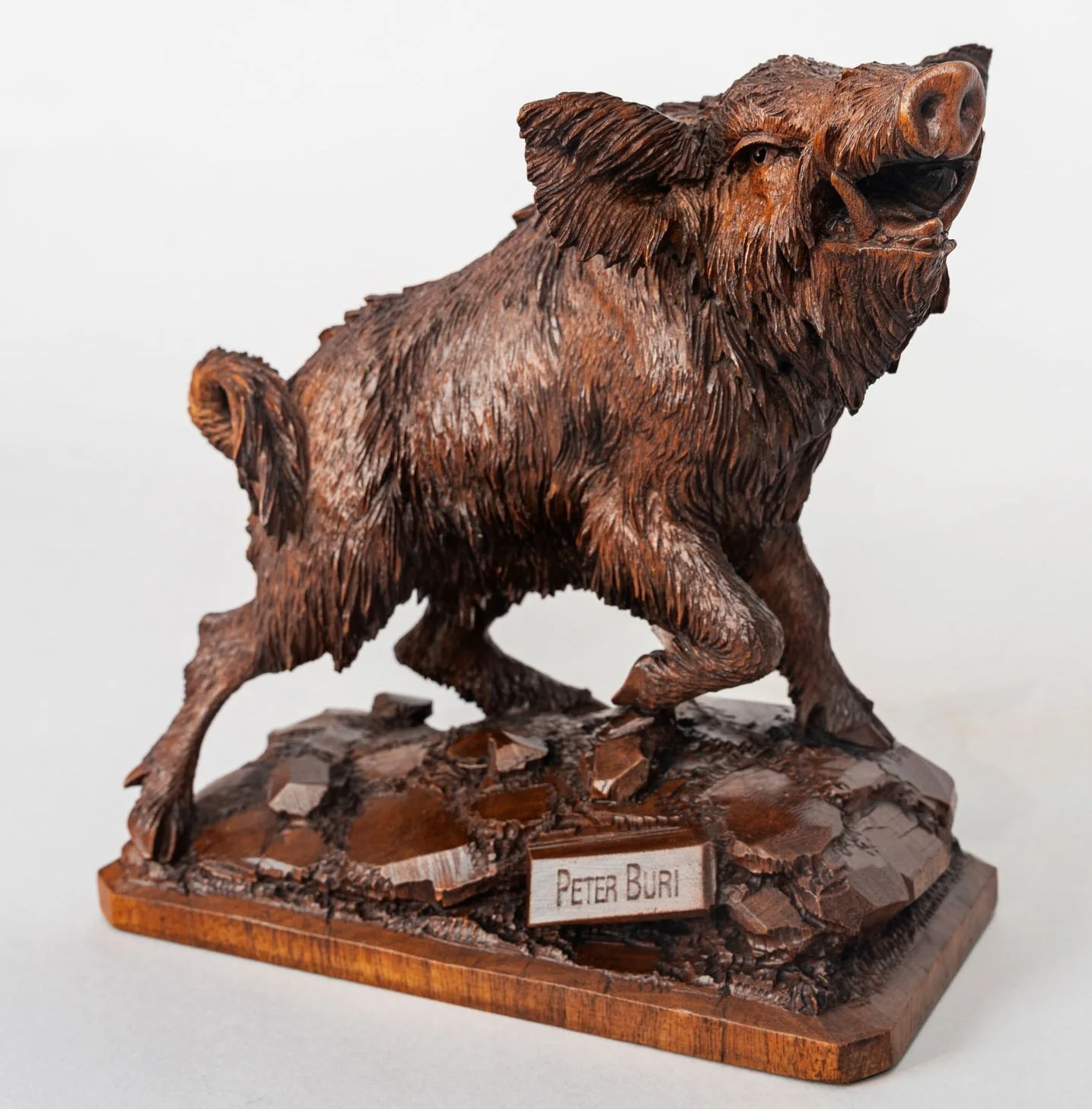 Swiss Black Forest carved walnut wild boar signed J. Huggler Brienz circa 1870, side view showing coat and musculature