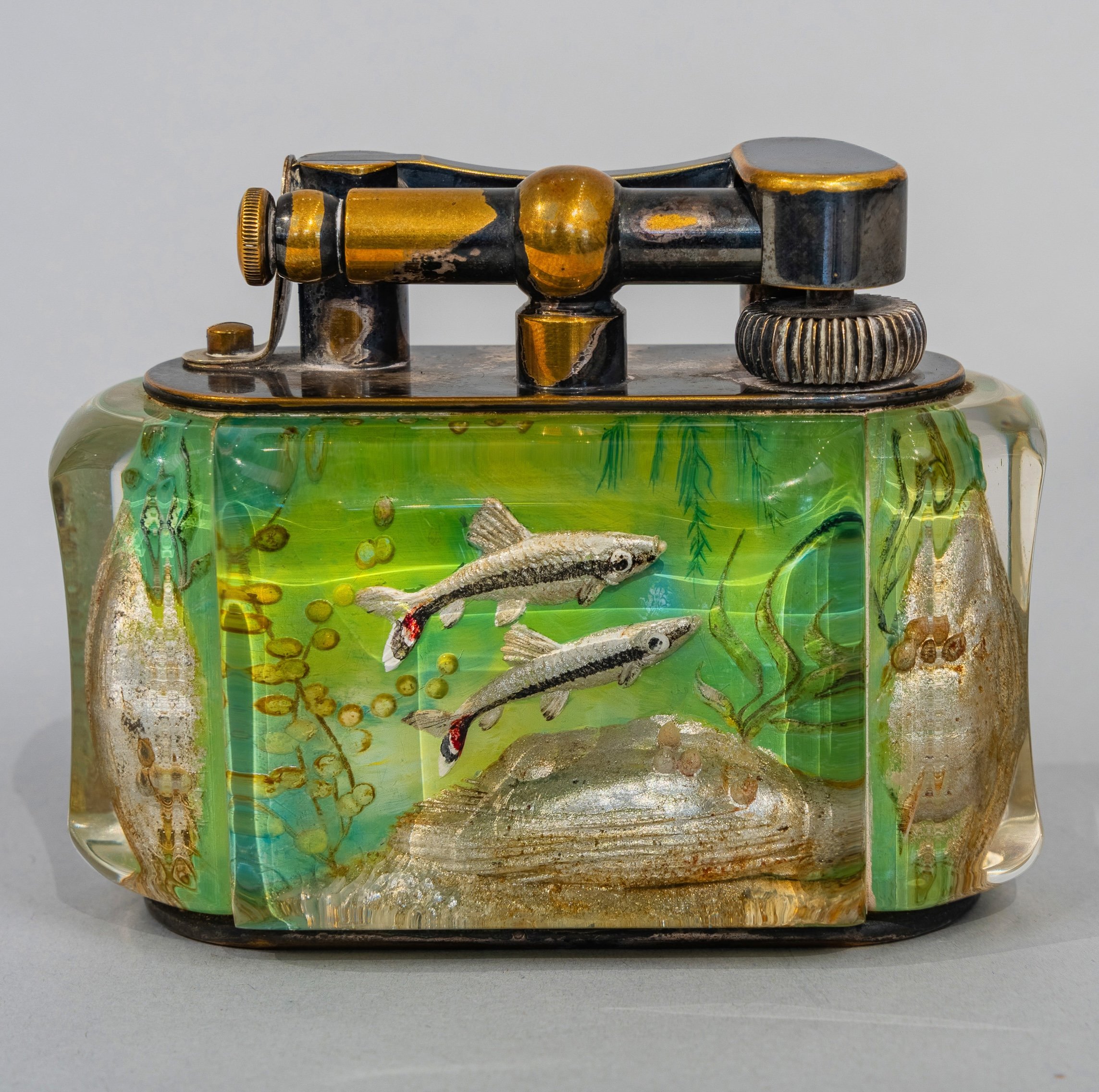 Dunhill Aquarium table lighter reverse, striped fish in emerald lucite, patinated gold hardware — Daniels Antiques