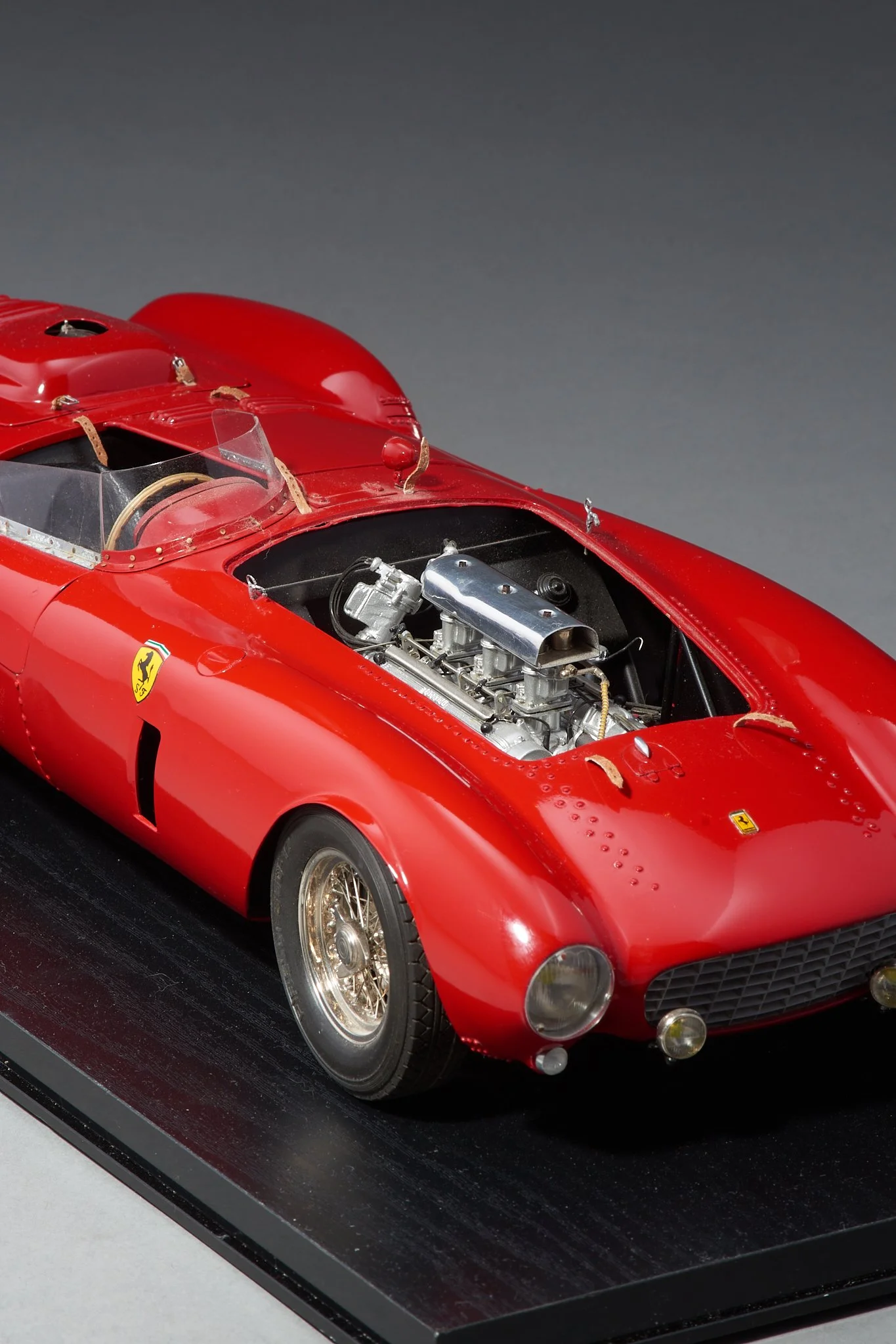 J. Catti Ferrari 375 Plus 1:12 model with V12 engine exposed under open hood — Daniels Antiques