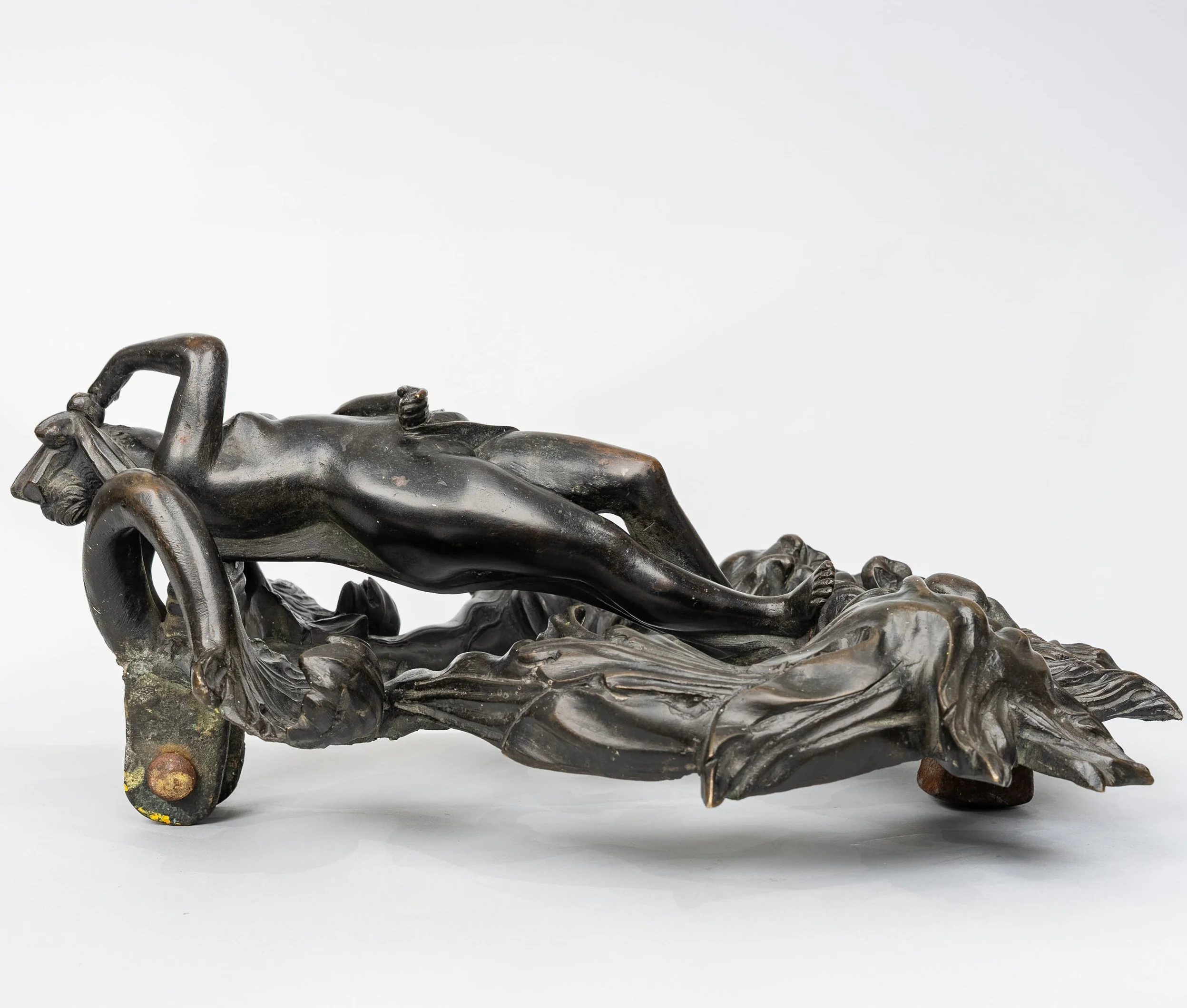 Side profile of a bronze Venus door knocker showing the figure modeled fully in the round — Daniels Antiques