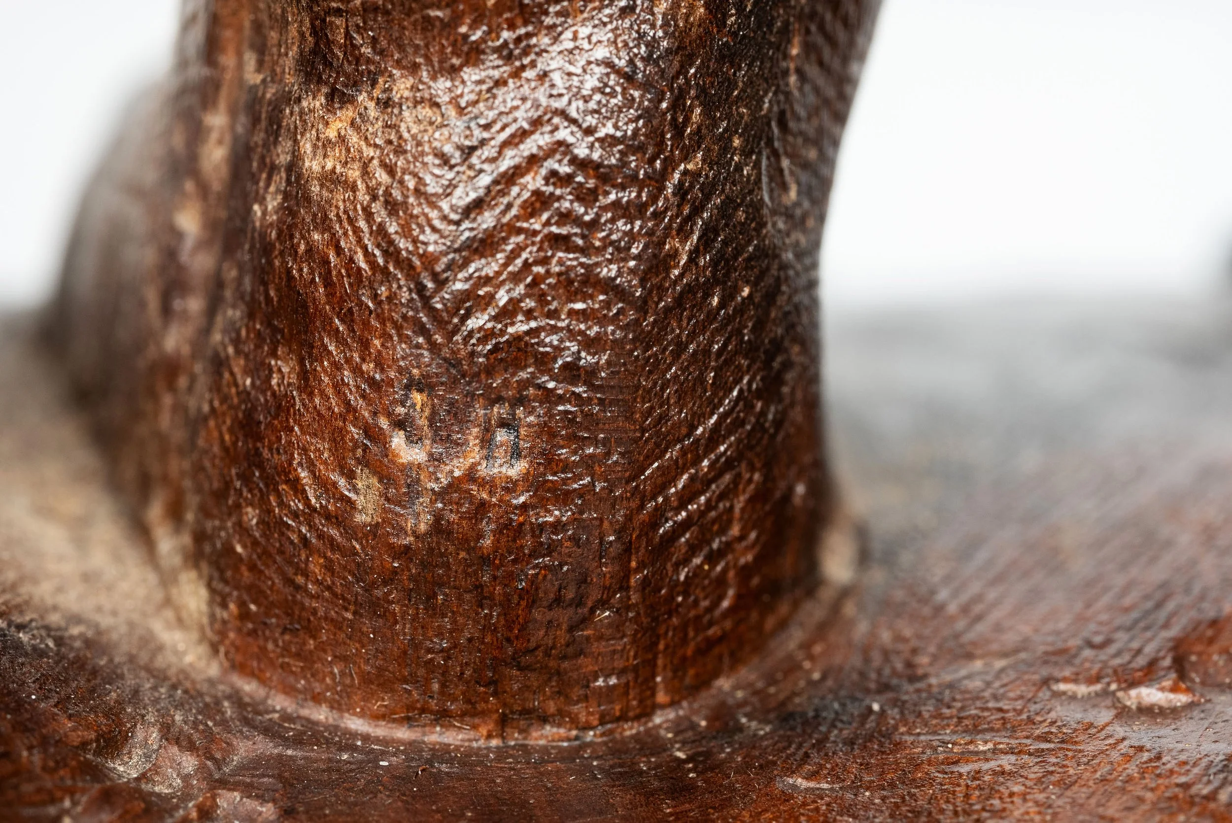 JH stamp of Johann Huggler on the boot of a Black Forest hunter figure — Daniels Antiques