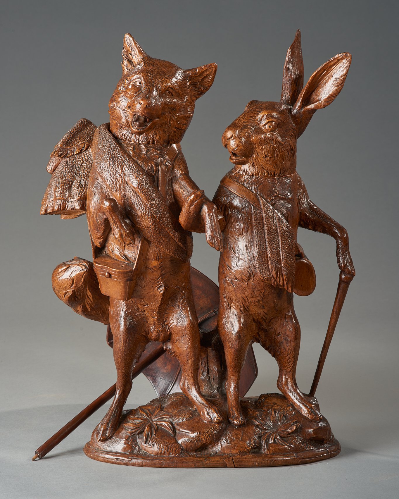 Swiss Black Forest carved walnut group of a fox and a hare, Brienz, circa 1880. Illustrated in Swiss Carvings: The Art of the Black Forest, 1820–1940, plate 00.