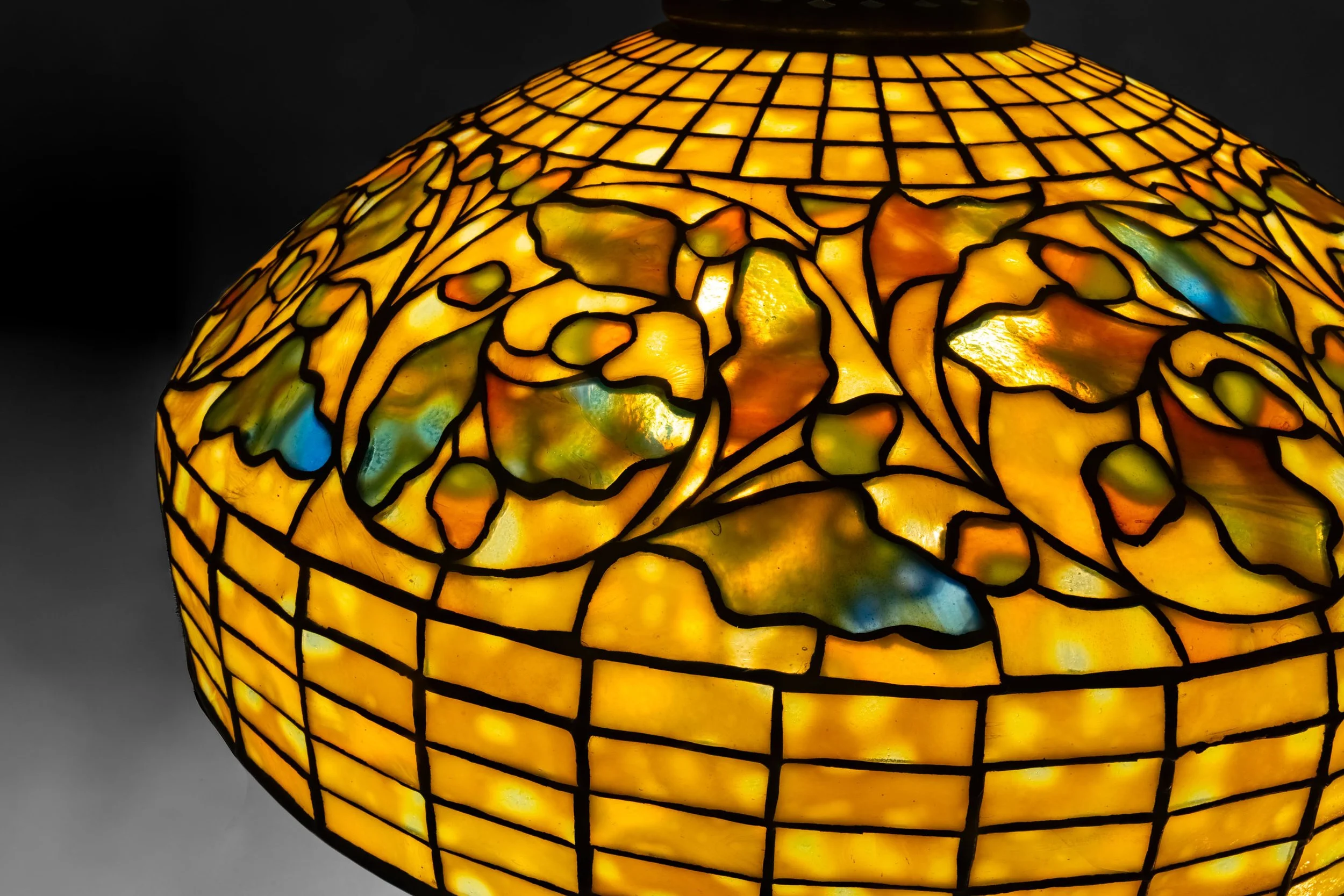 Tiffany Studios Swirling Oak Leaf lamp shade detail, iridescent amber and green leaded glass — Daniels Antiques