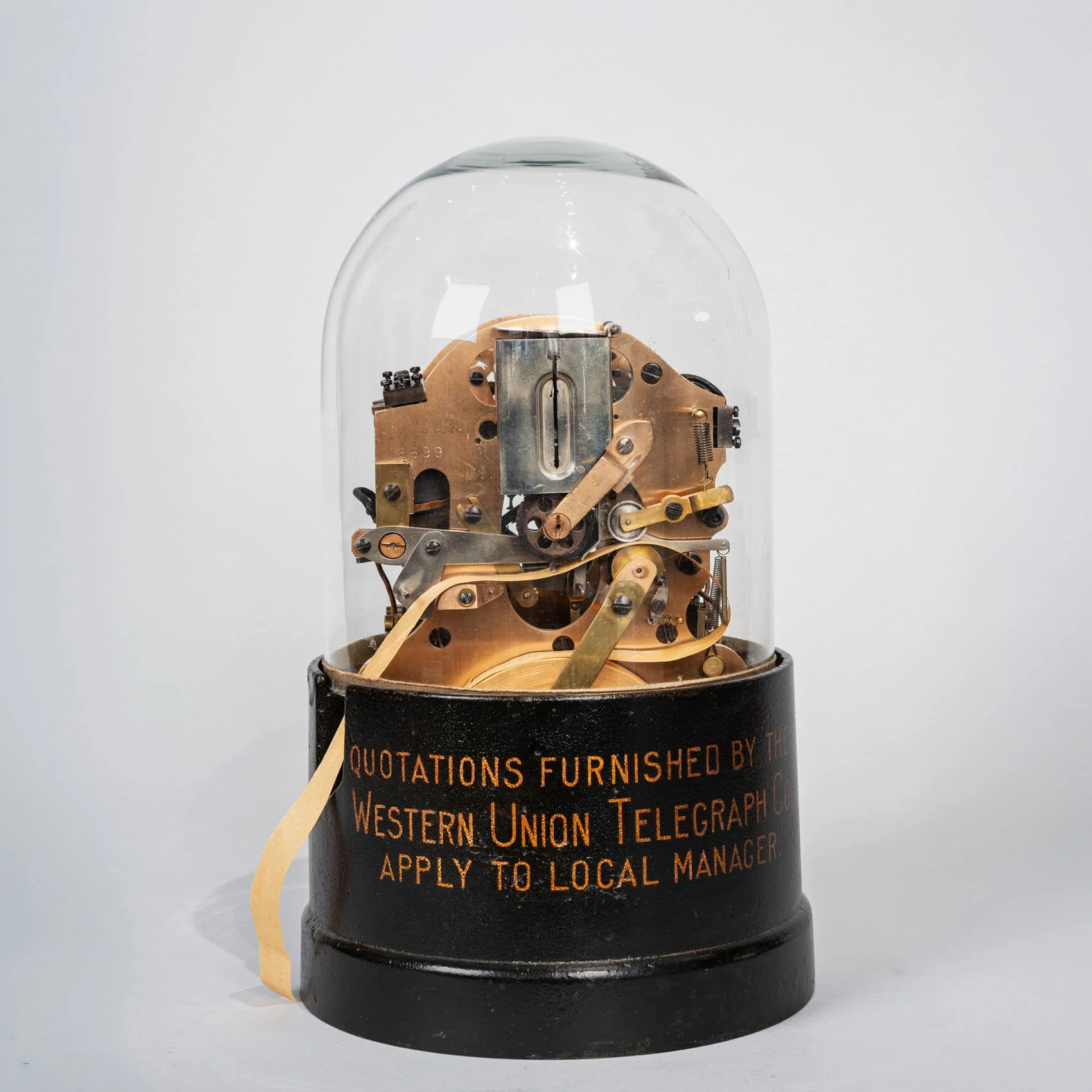 Western Union stock ticker 1915, manufactured by T.A. Edison Inc., full view with original glass dome