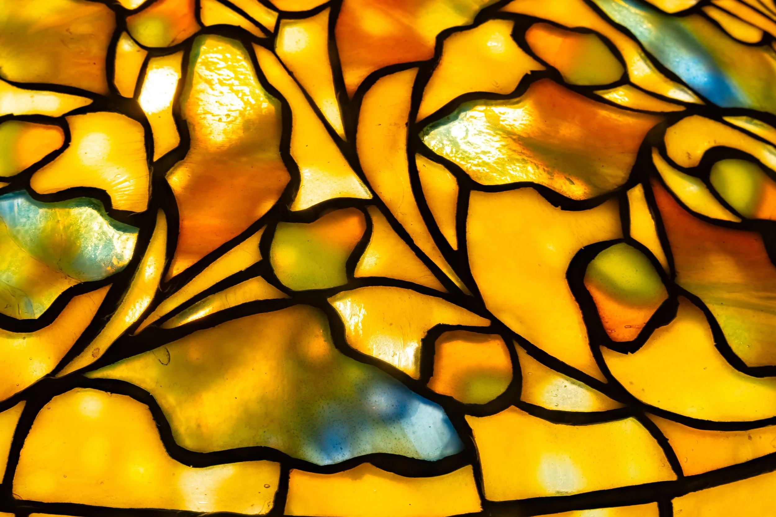Tiffany Studios Swirling Oak Leaf lamp glass macro detail, amber shifting to cobalt blue — Daniels Antiques