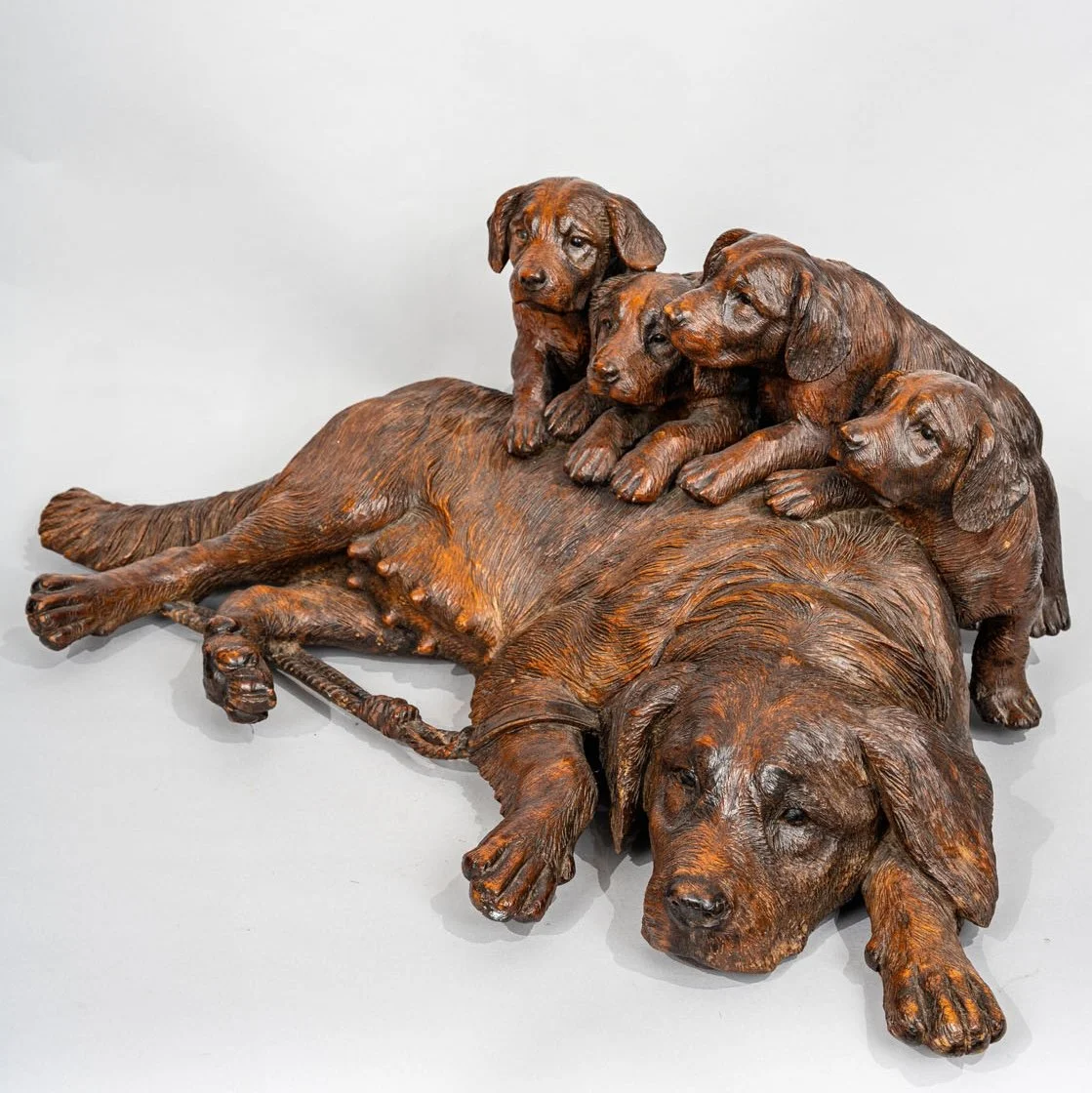 Swiss Black Forest carved walnut group of recumbent hound and four pups, Walter Mader, Brienz circa 1870, full view