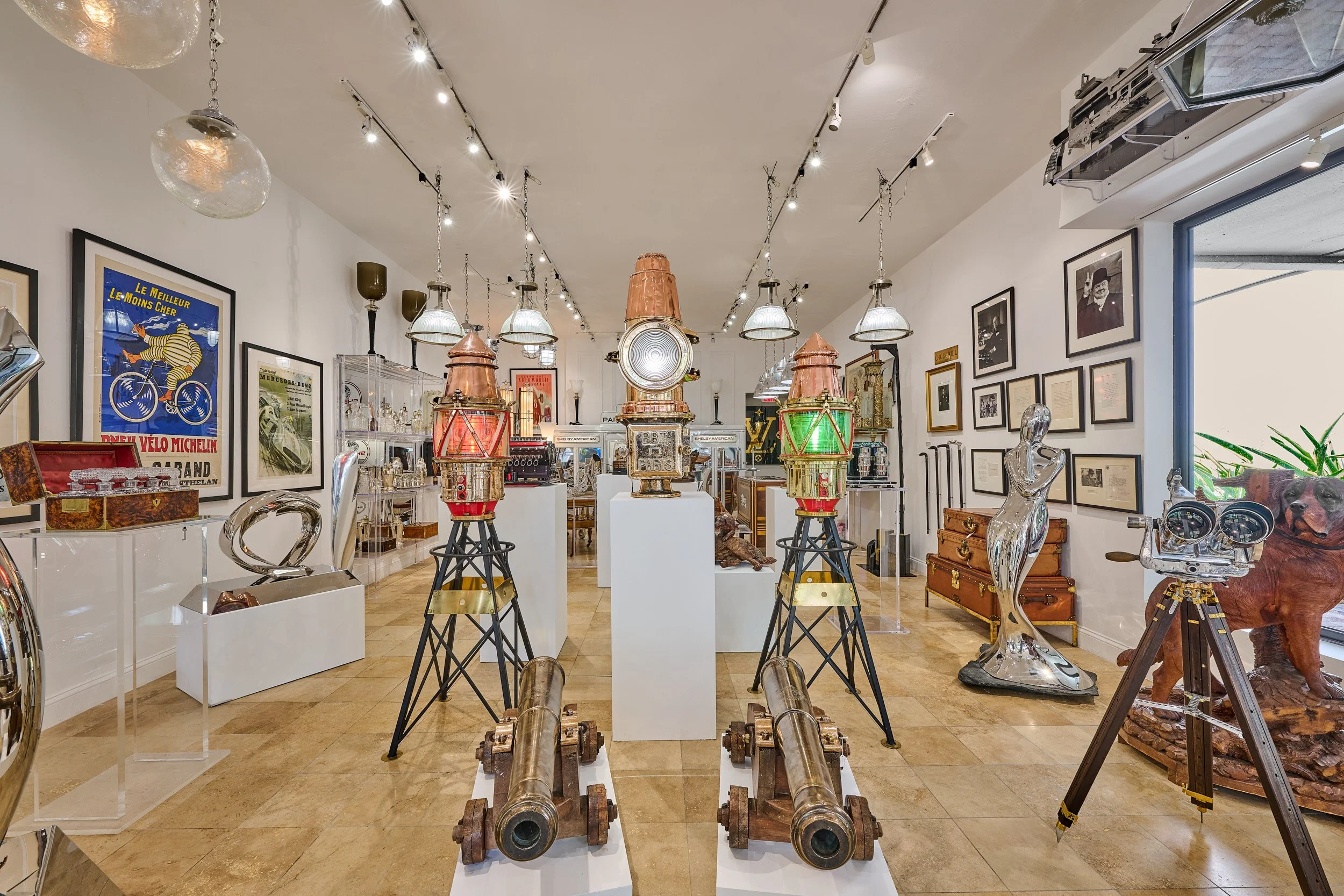 Matched pair antique harbor channel marker beacon lights, red and green, displayed in Daniels Antiques Fort Lauderdale — Daniels Antiques